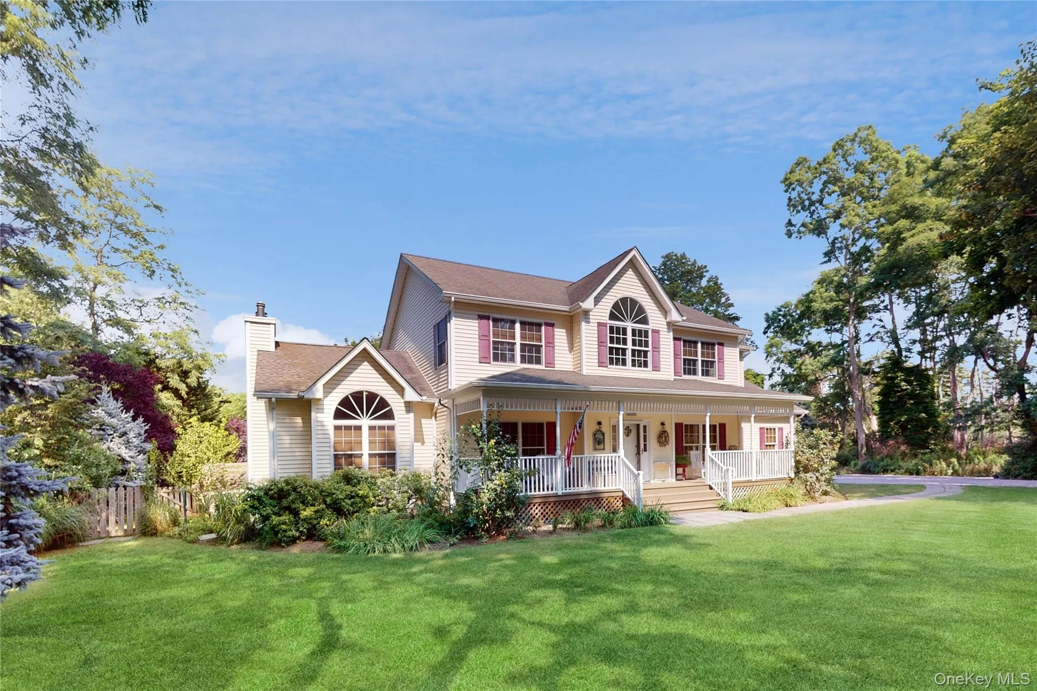 View of front facade with a porch and a chimney View of front facade with a porch and a chimney
