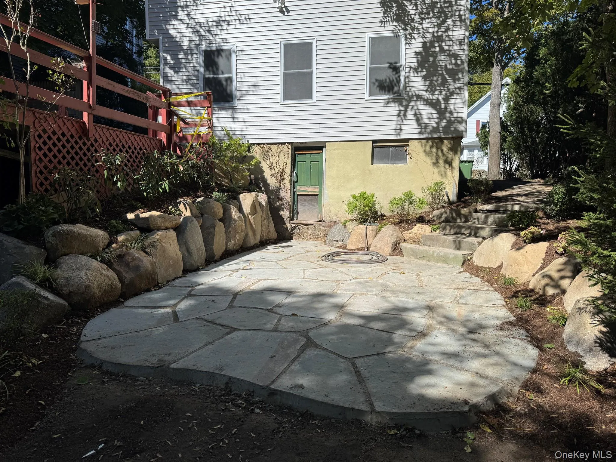 Rear view of property with a patio area and stucco siding Rear view of property with a patio area and stucco siding