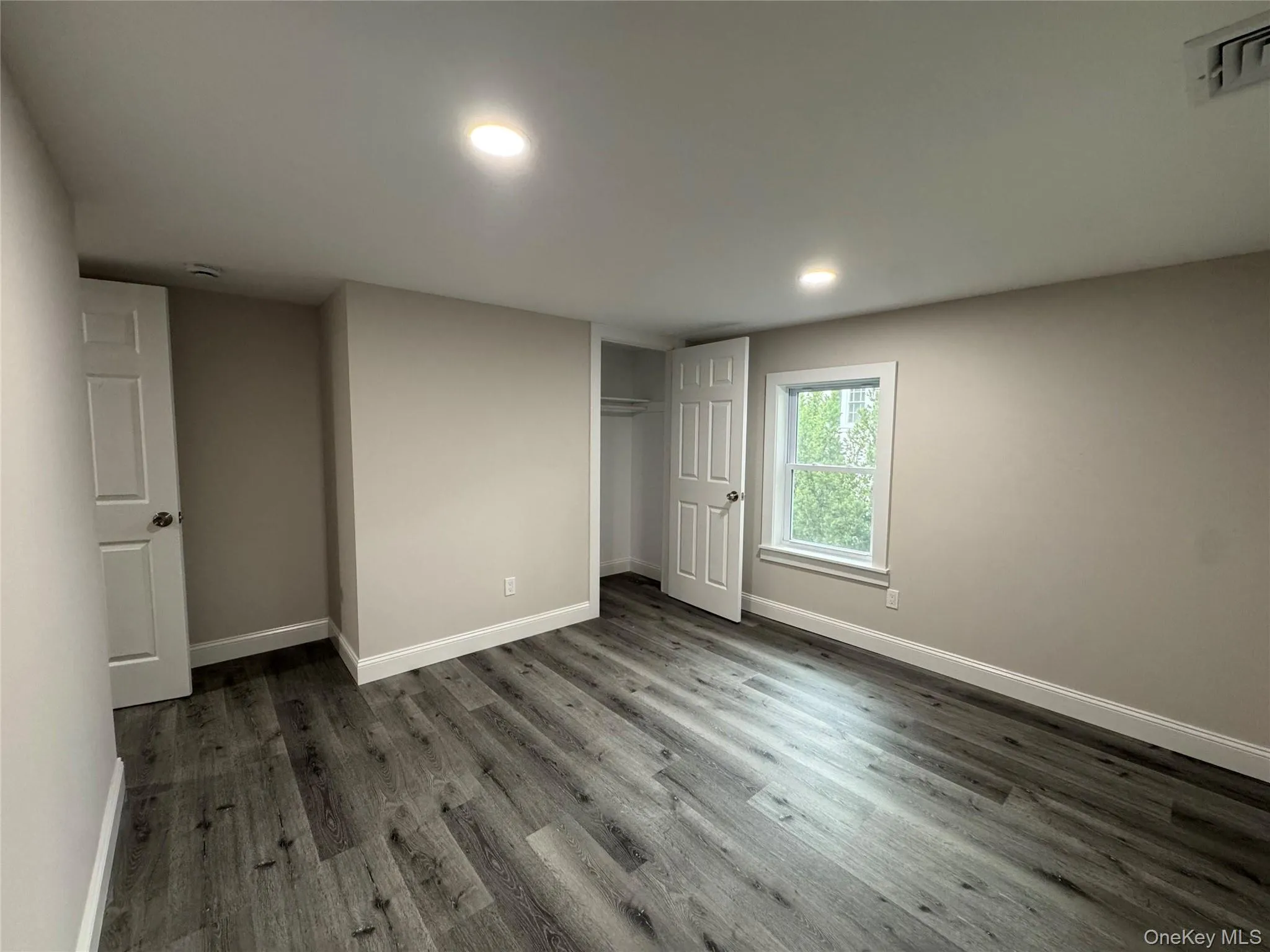 Unfurnished bedroom featuring wood finished floors, a closet, and recessed lighting Unfurnished bedroom featuring wood finished floors, a closet, and recessed lighting