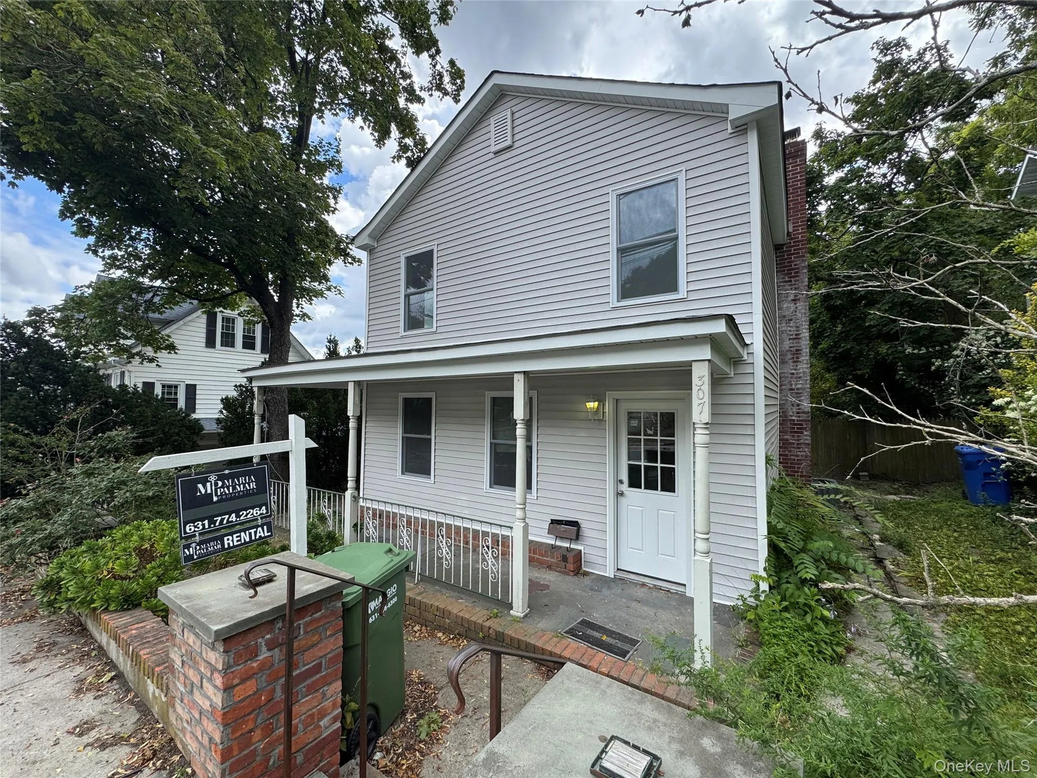 Back of property featuring covered porch Back of property featuring covered porch