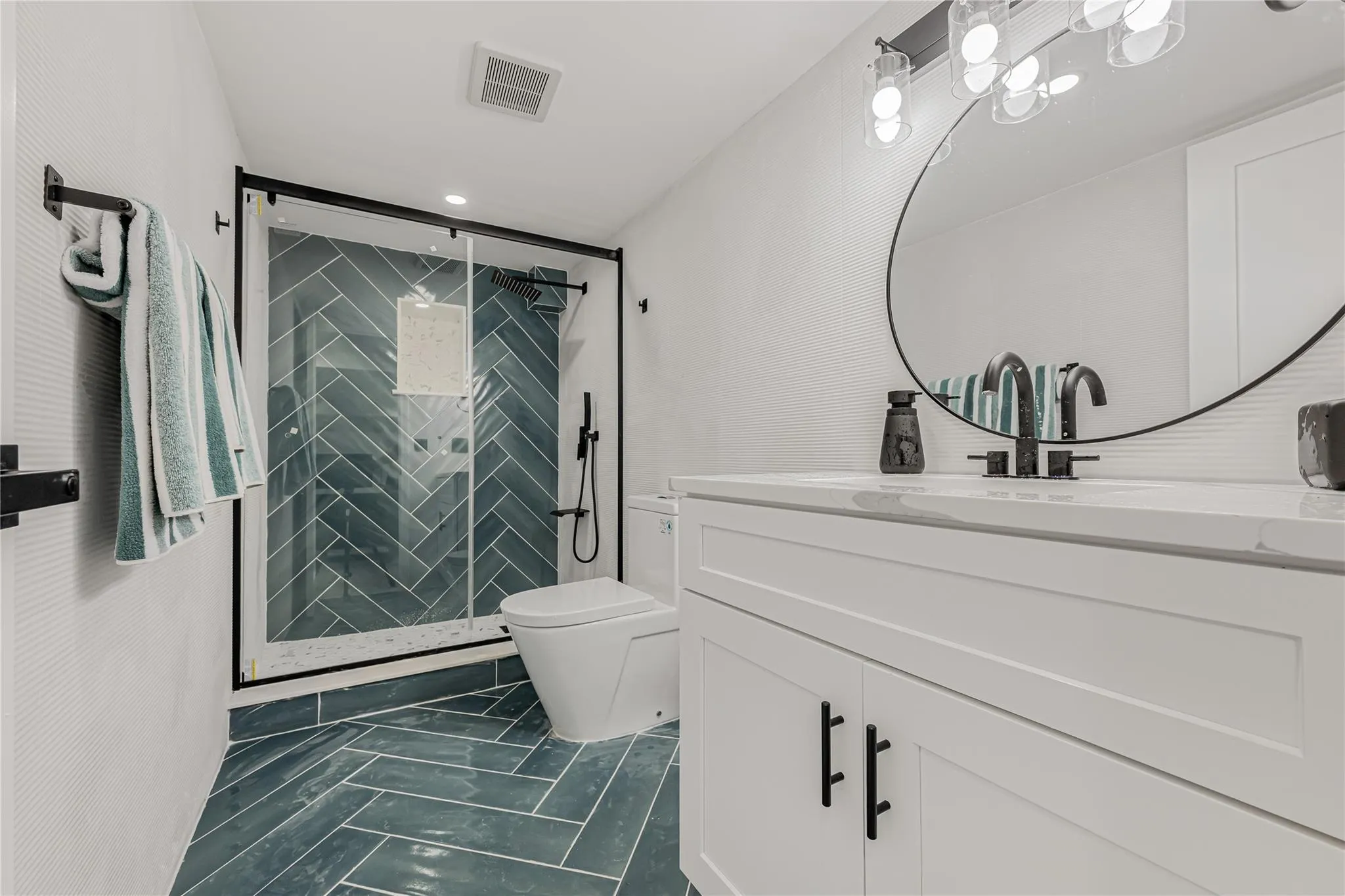 Full bathroom with vanity and a stall shower Full bathroom with vanity and a stall shower