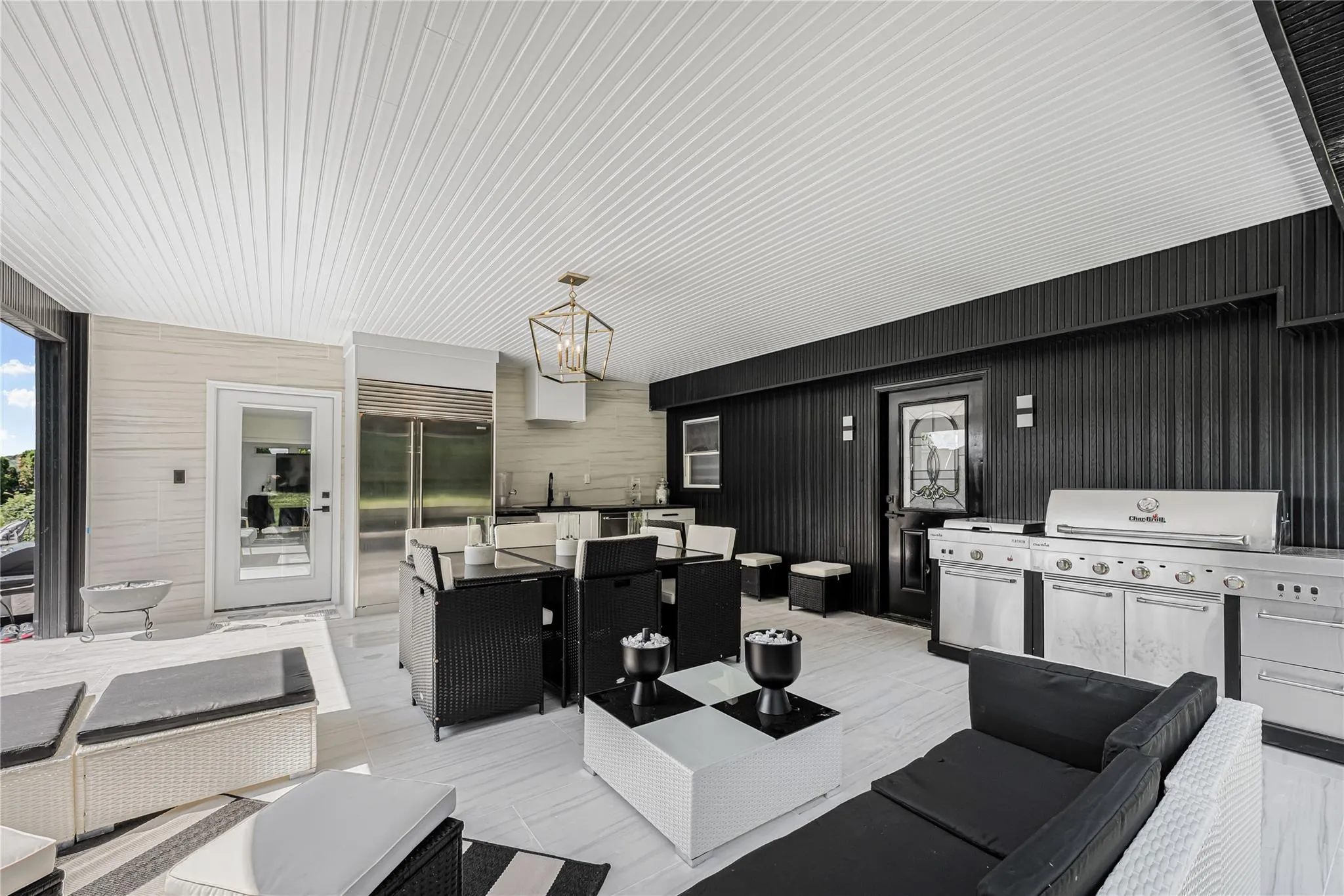 View of patio / terrace with an outdoor hangout area, outdoor dining space, and area for grilling View of patio / terrace with an outdoor hangout area, outdoor dining space, and area for grilling