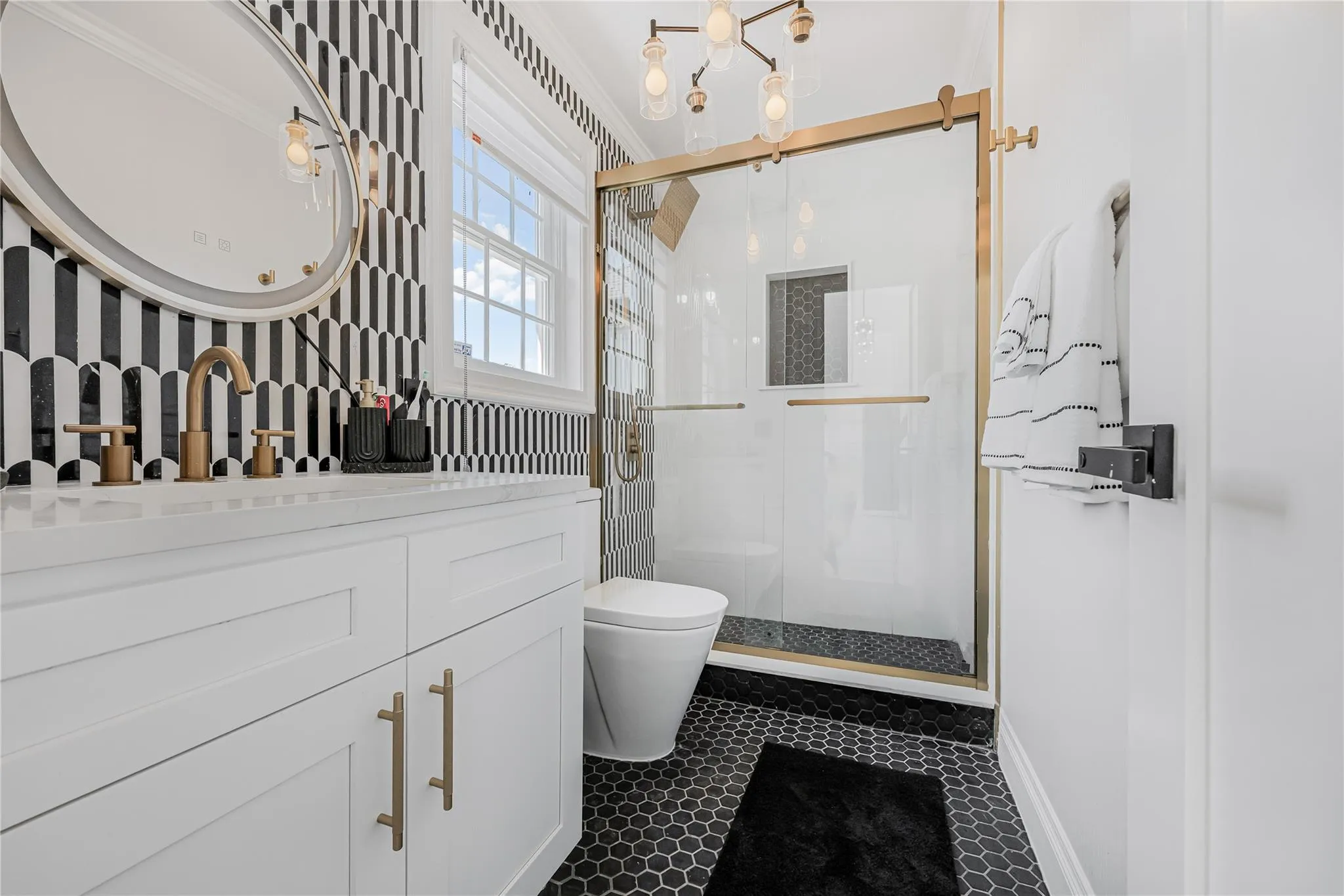 Full bathroom featuring a stall shower and vanity Full bathroom featuring a stall shower and vanity