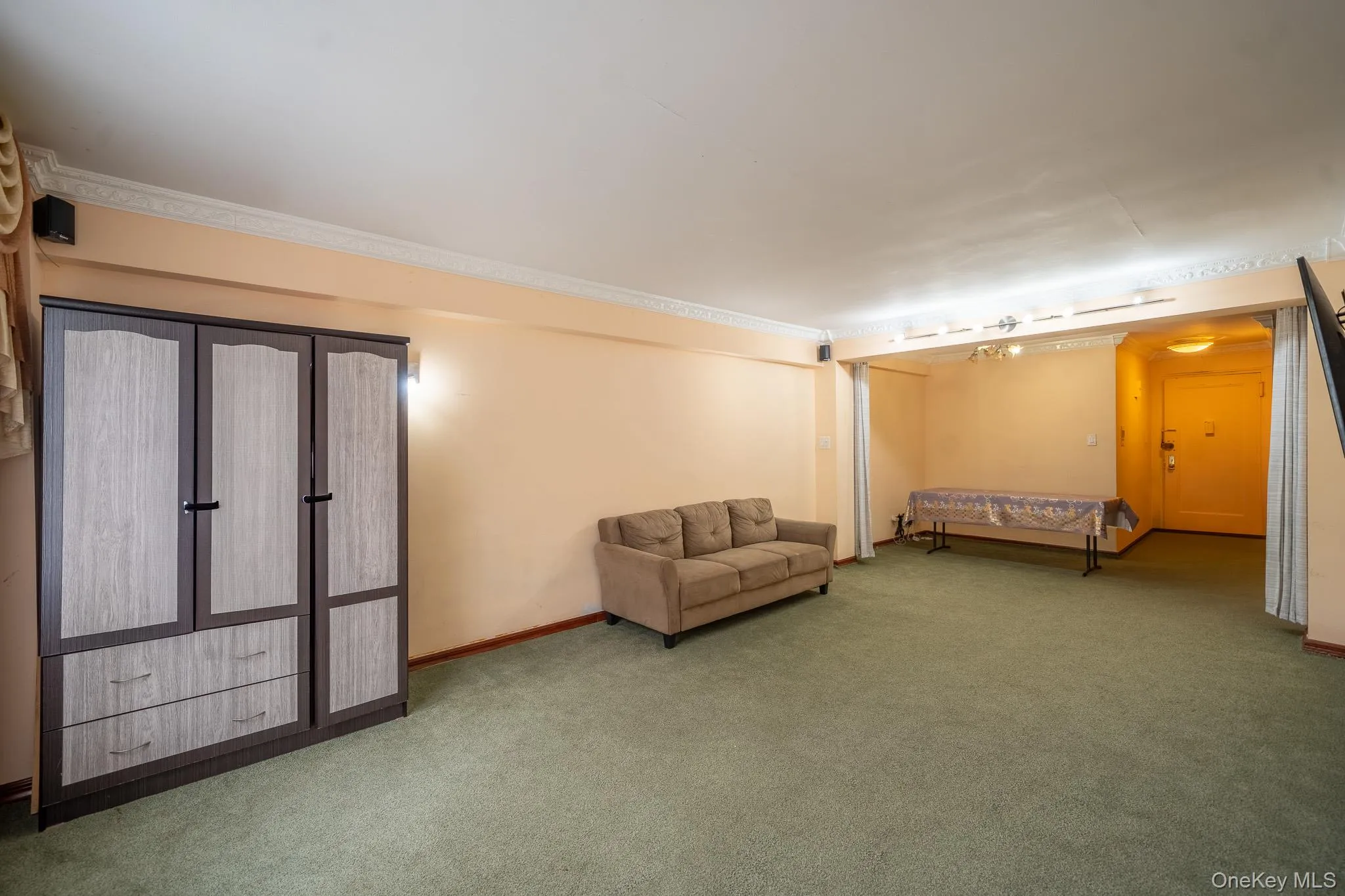 Unfurnished bedroom with carpet flooring and baseboards Unfurnished bedroom with carpet flooring and baseboards