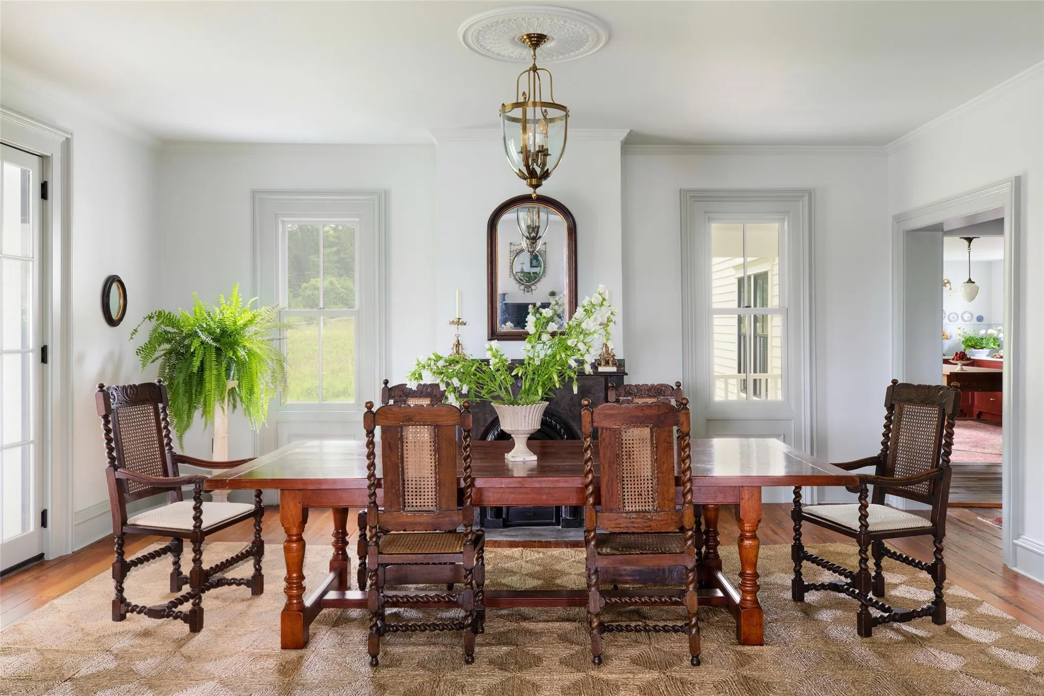 Dining room with wood finished floors and ornamental molding Dining room with wood finished floors and ornamental molding