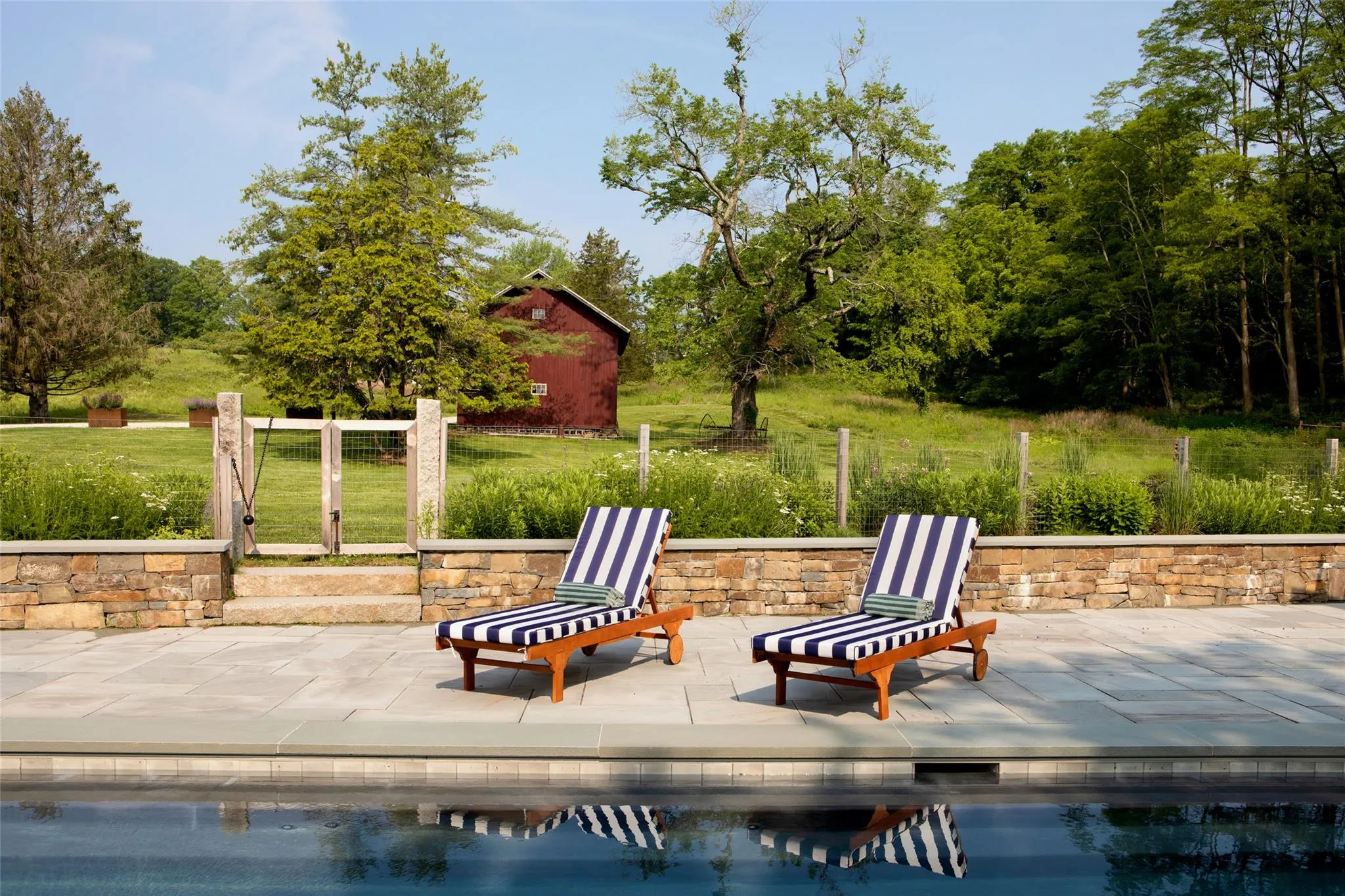 View of pool with a patio area View of pool with a patio area