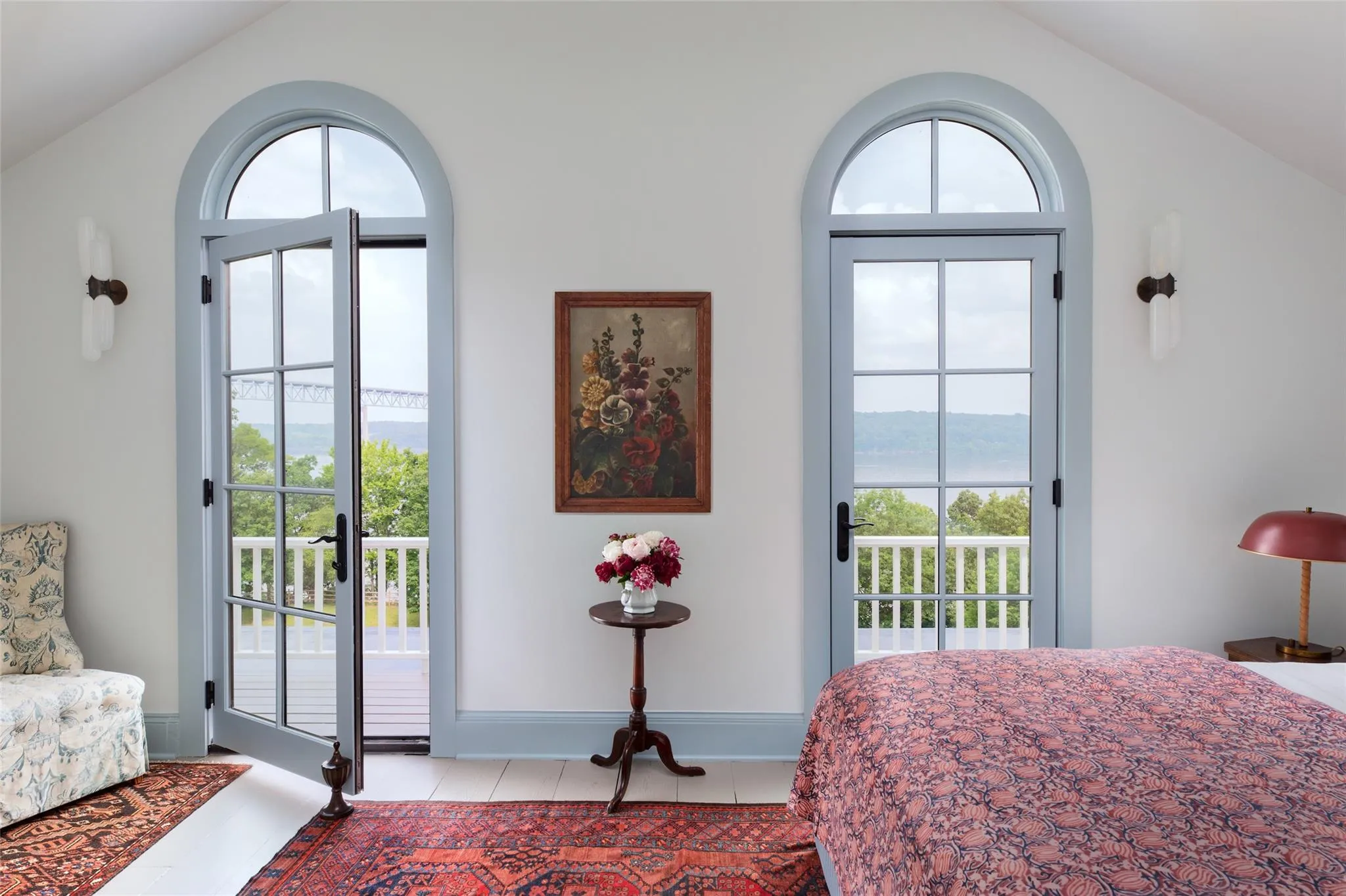Bedroom with vaulted ceiling, multiple windows, access to exterior, and tile patterned floors Bedroom with vaulted ceiling, multiple windows, access to exterior, and tile patterned floors
