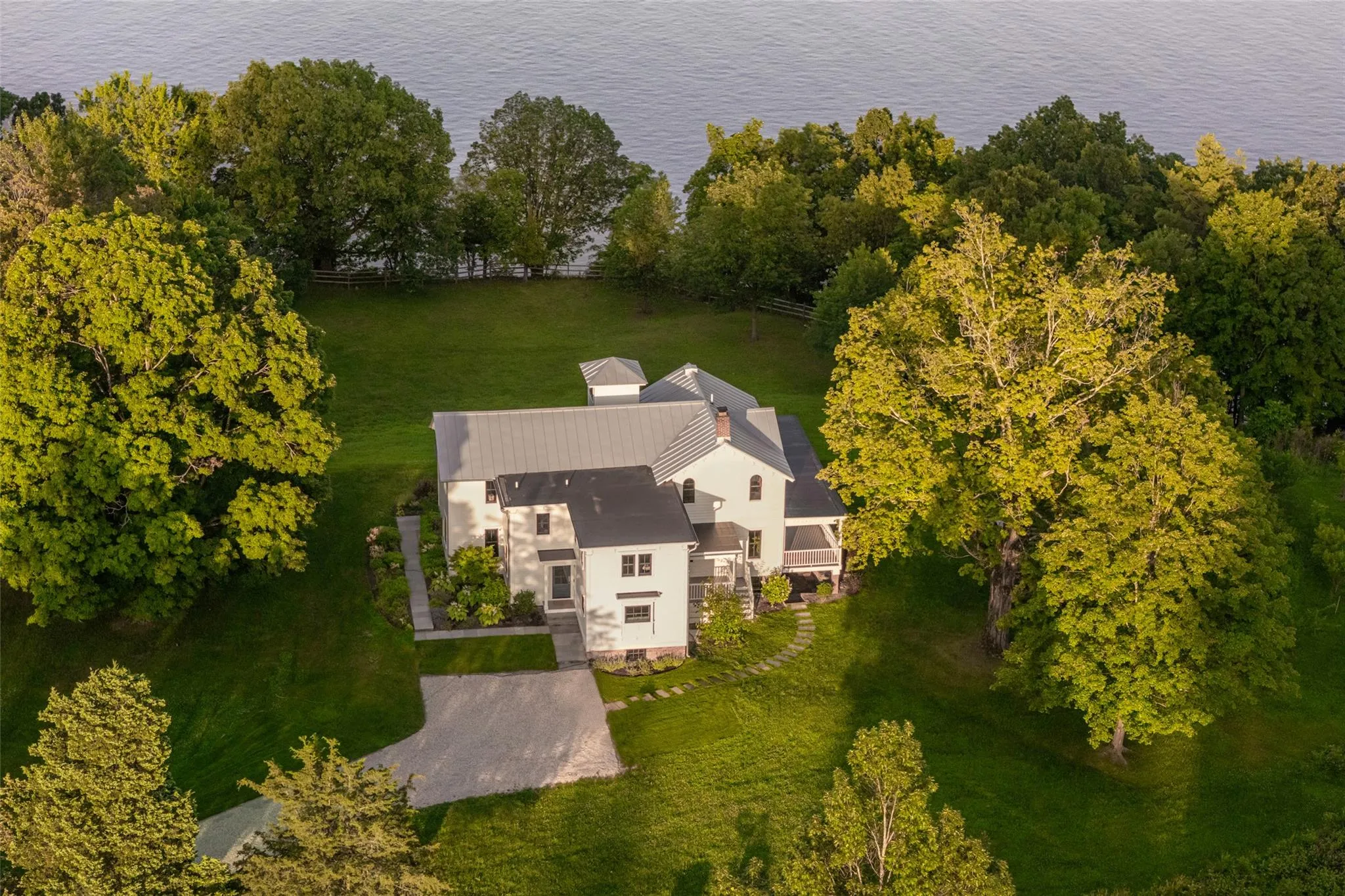 Aerial view of property and surrounding area featuring a nearby body of water Aerial view of property and surrounding area featuring a nearby body of water