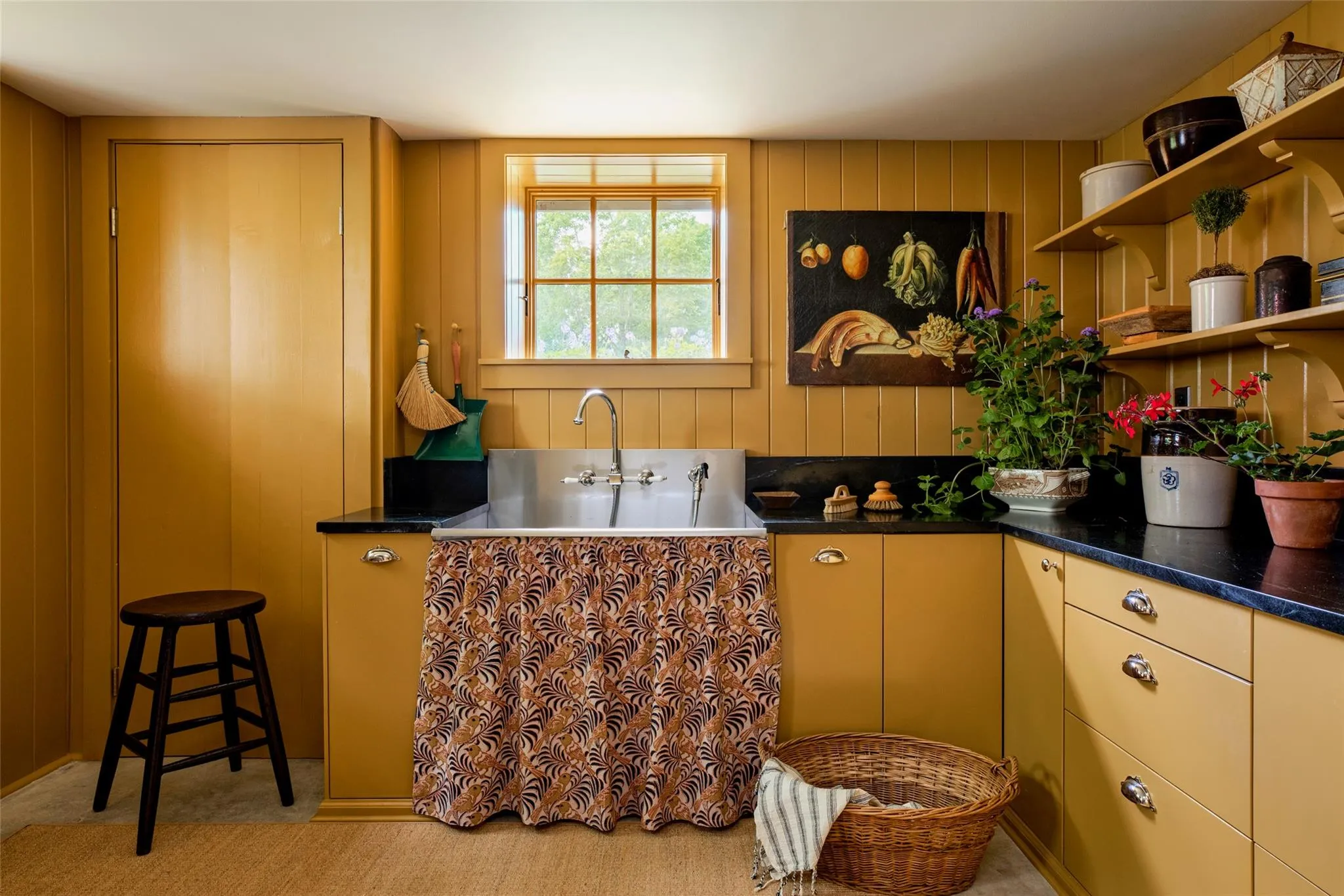 Kitchen featuring open shelves and dark countertops Kitchen featuring open shelves and dark countertops