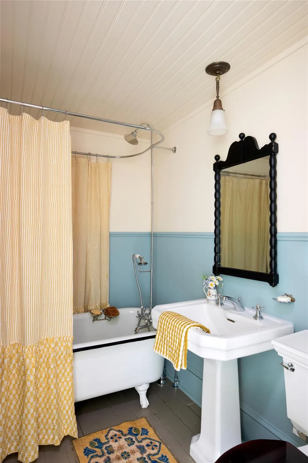 Bathroom featuring shower / bath combo with shower curtain, wood ceiling, and tile patterned flooring Bathroom featuring shower / bath combo with shower curtain, wood ceiling, and tile patterned flooring