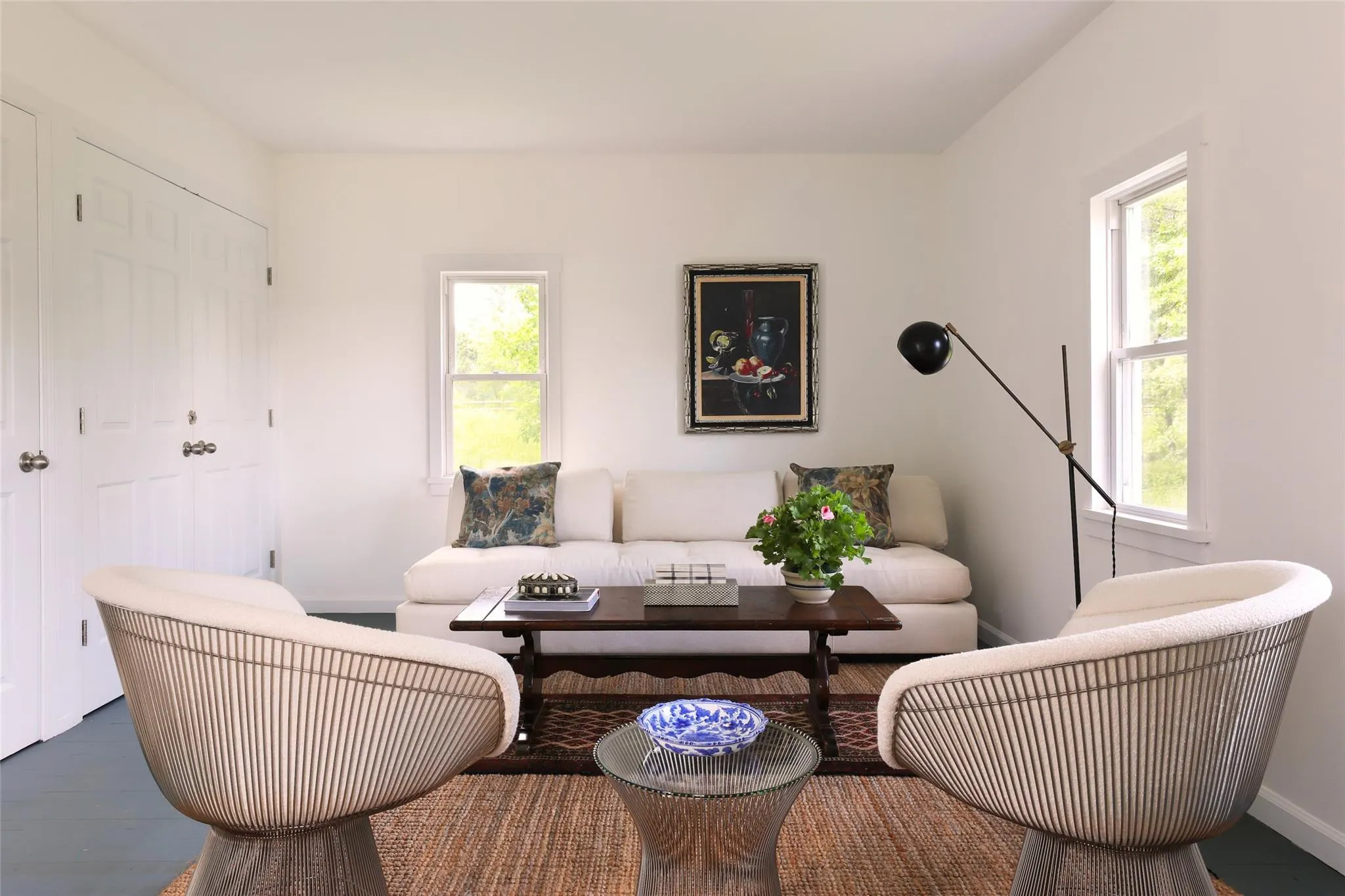 Living area with baseboards and wood finished floors Living area with baseboards and wood finished floors