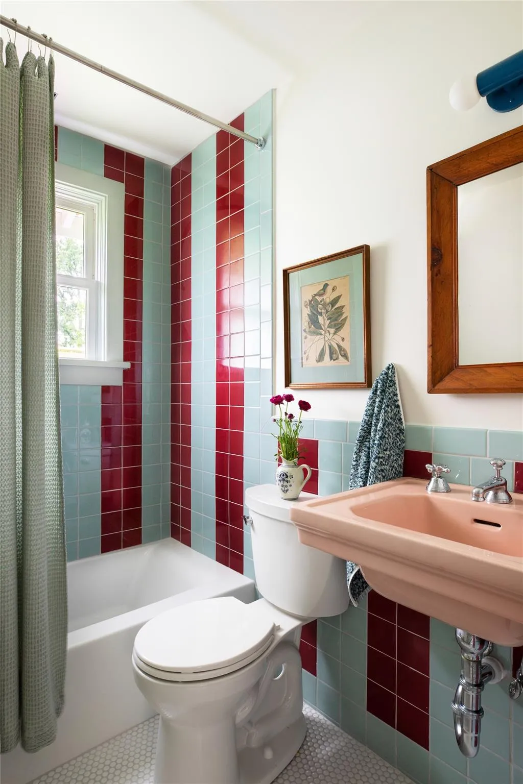 Bathroom featuring tile walls, tile patterned flooring, and shower / bath combo with shower curtain Bathroom featuring tile walls, tile patterned flooring, and shower / bath combo with shower curtain