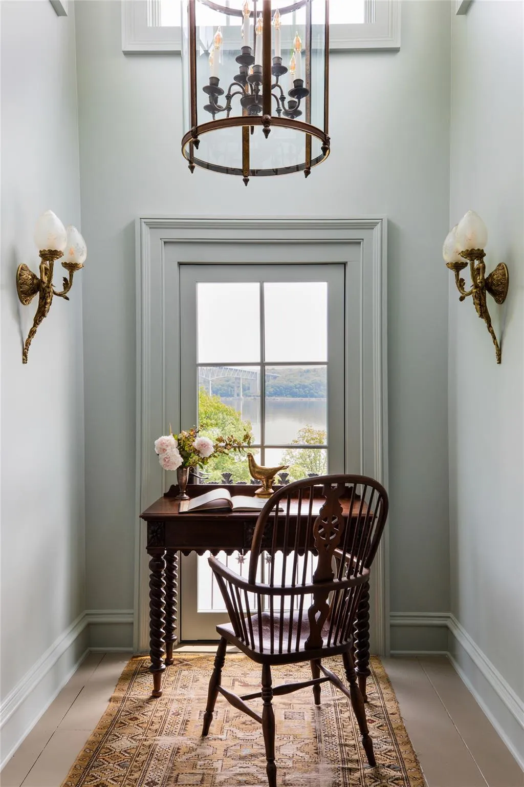 Dining space with a chandelier, an office area, and a water view Dining space with a chandelier, an office area, and a water view