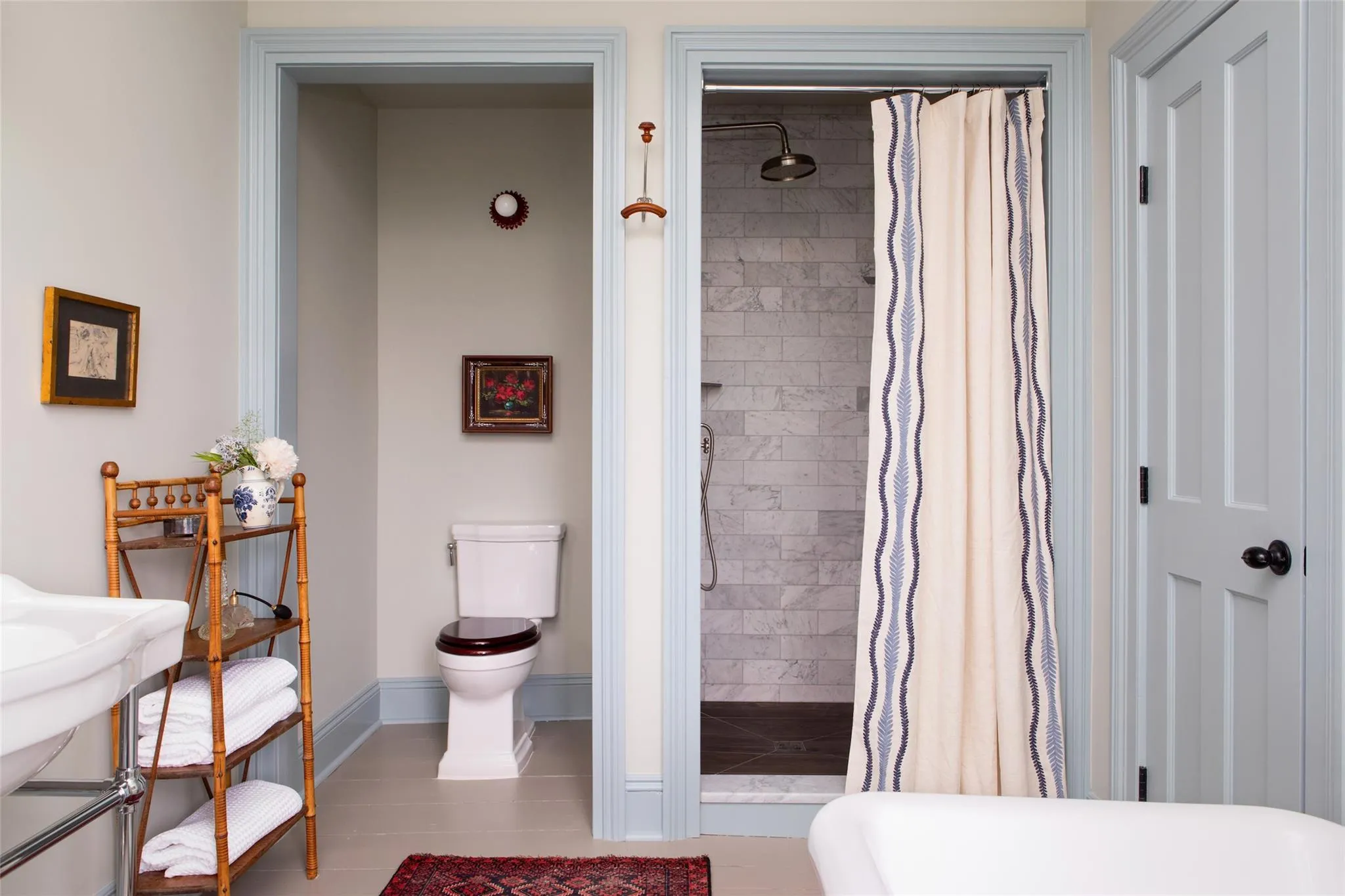 Bathroom featuring toilet and a shower stall Bathroom featuring toilet and a shower stall