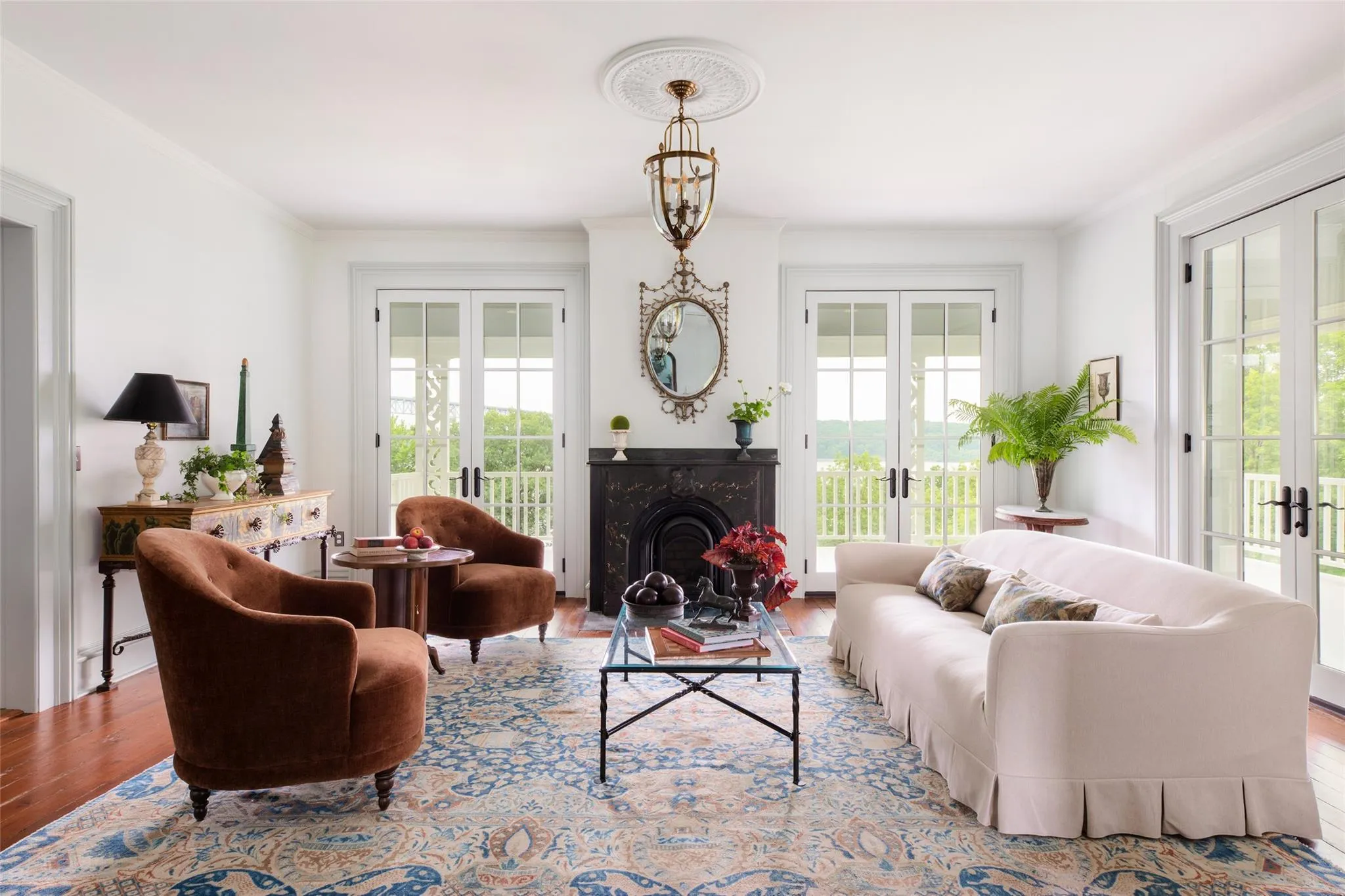 Living area with french doors, plenty of natural light, and crown molding Living area with french doors, plenty of natural light, and crown molding