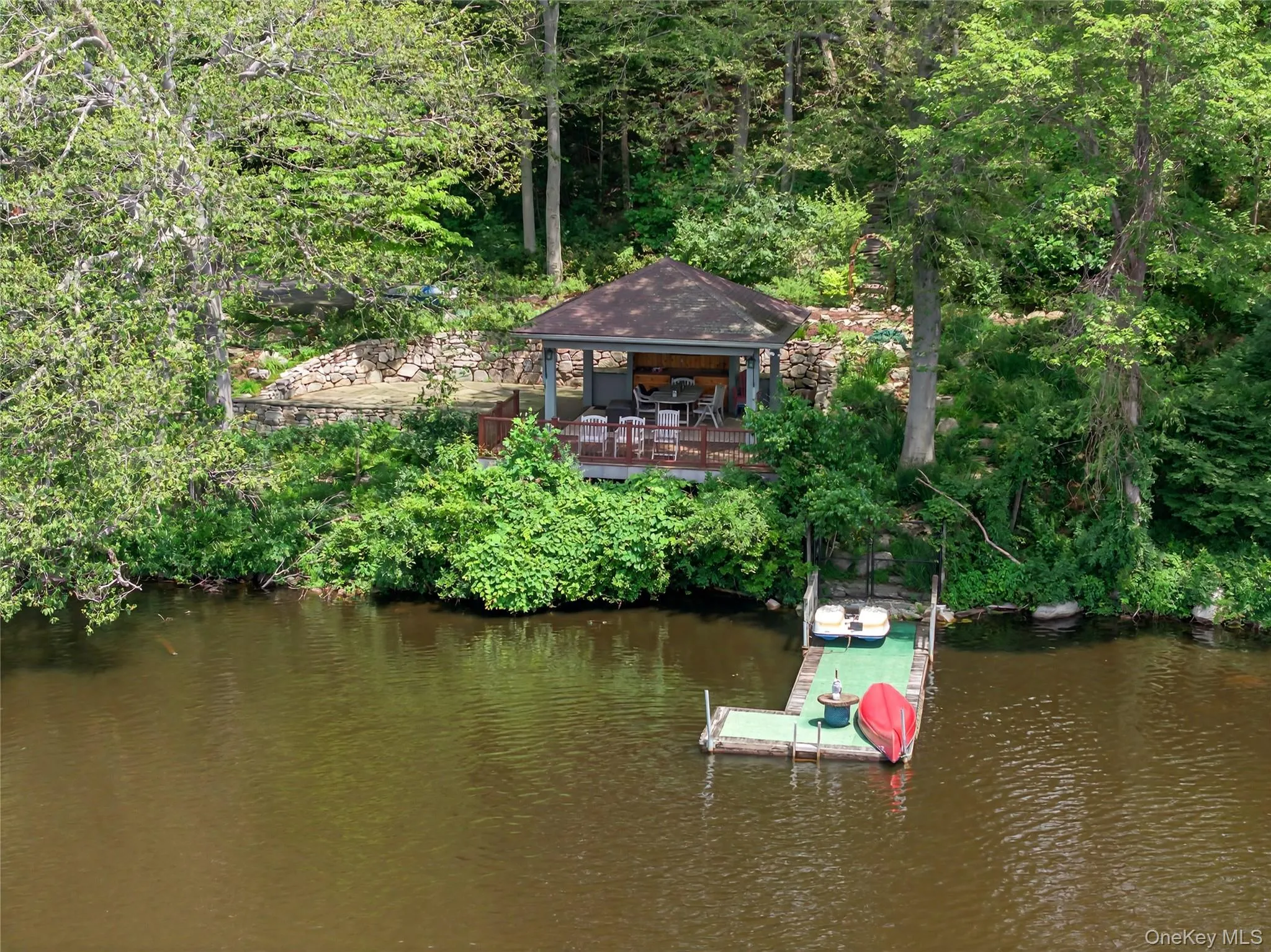 View of subject property featuring a nearby body of water View of subject property featuring a nearby body of water