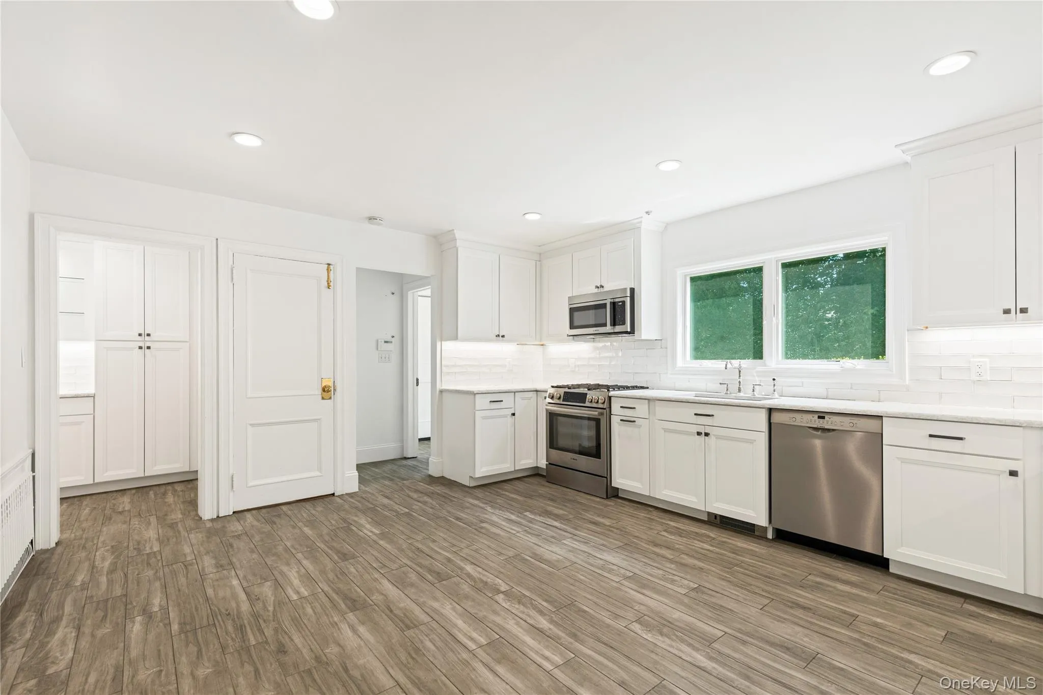 Adjacent to the mudroom, two car garage and staircase to the lower level Adjacent to the mudroom, two car garage and staircase to the lower level