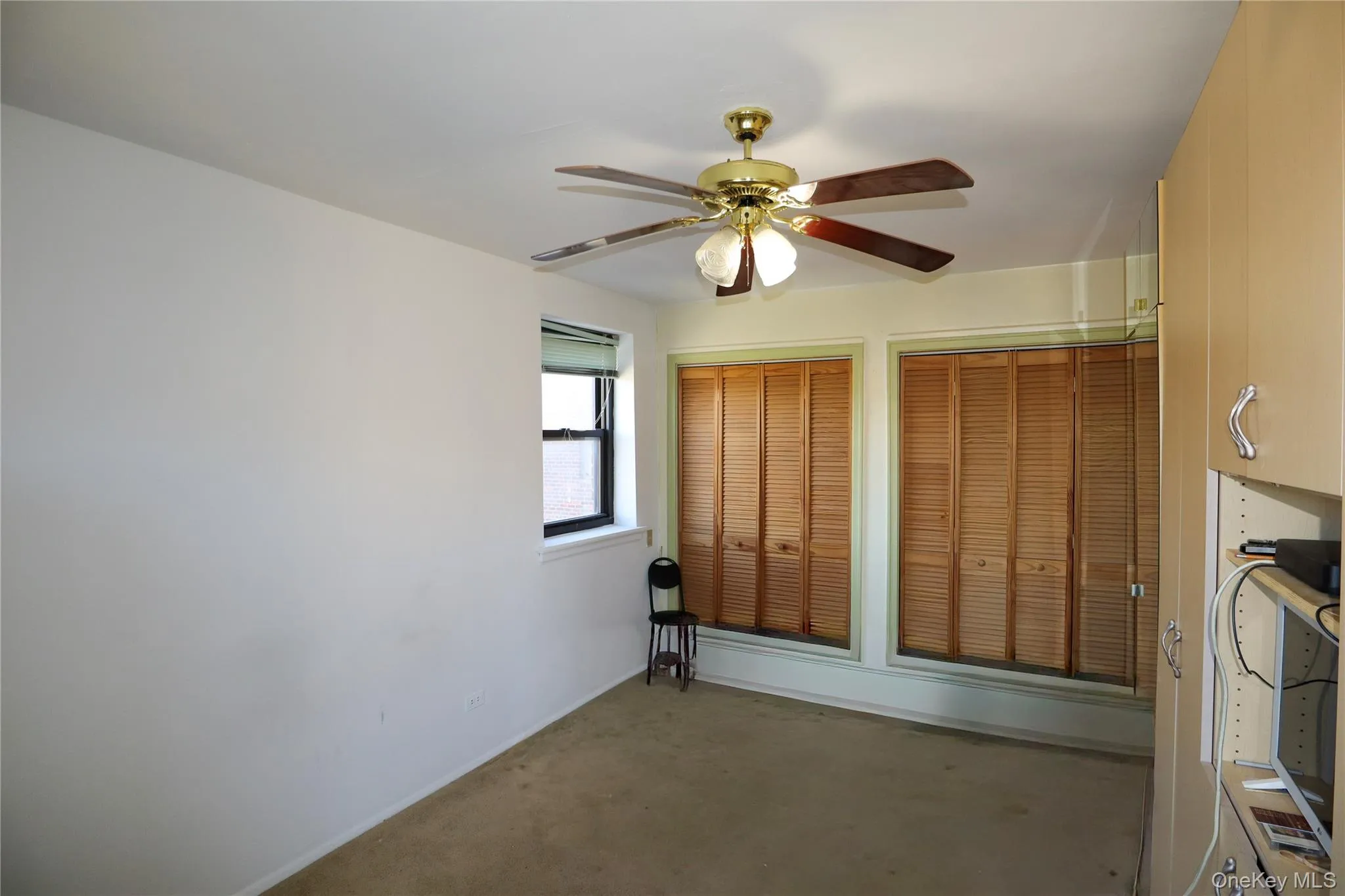 Unfurnished bedroom featuring ceiling fan and baseboards Unfurnished bedroom featuring ceiling fan and baseboards