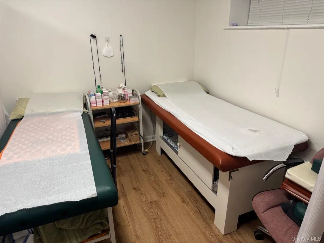 Bedroom featuring wood finished floors Bedroom featuring wood finished floors