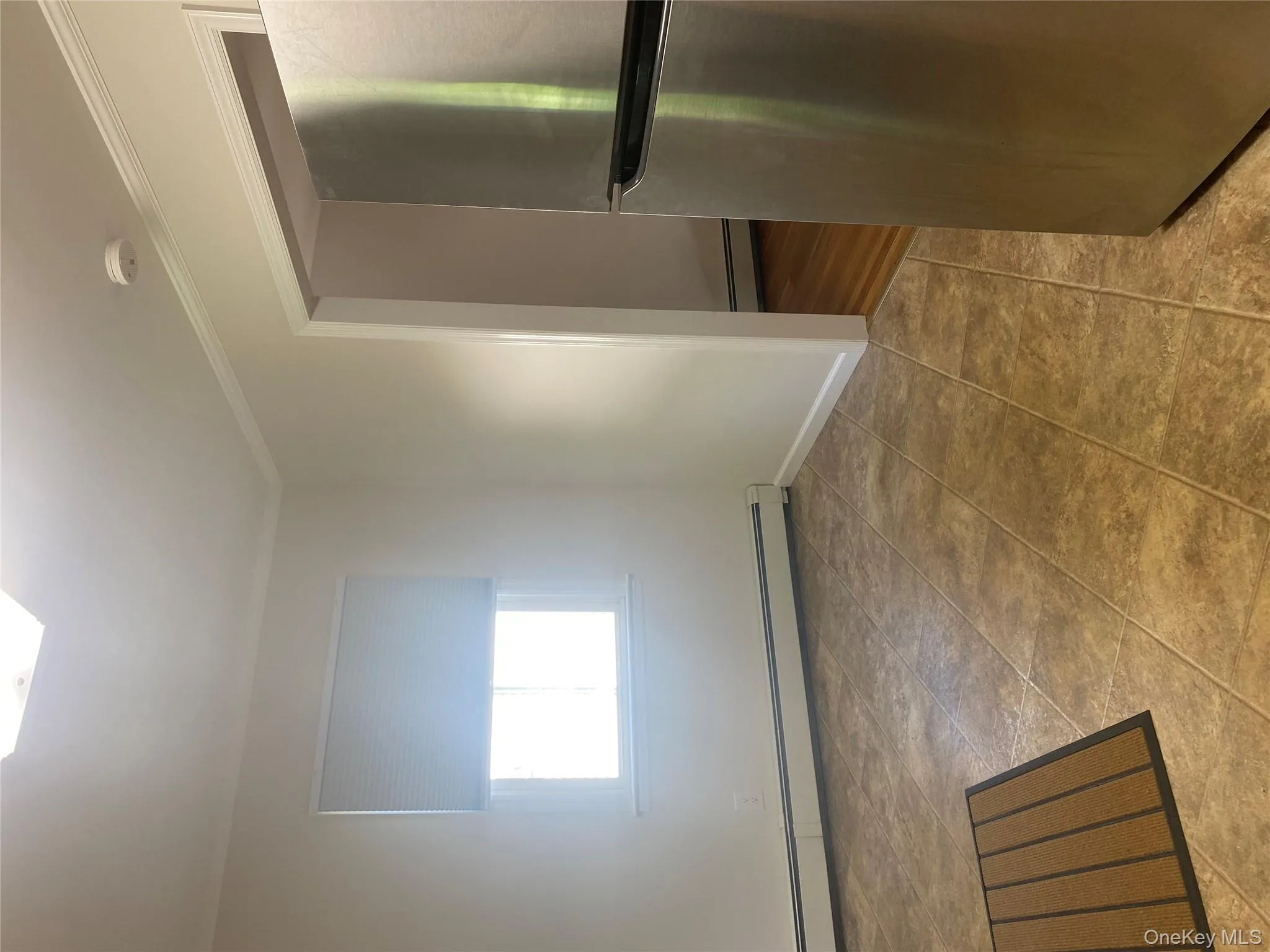 Eat in Kitchen with a smoke detector, a baseboard heating unit, and ornamental molding Eat in Kitchen with a smoke detector, a baseboard heating unit, and ornamental molding