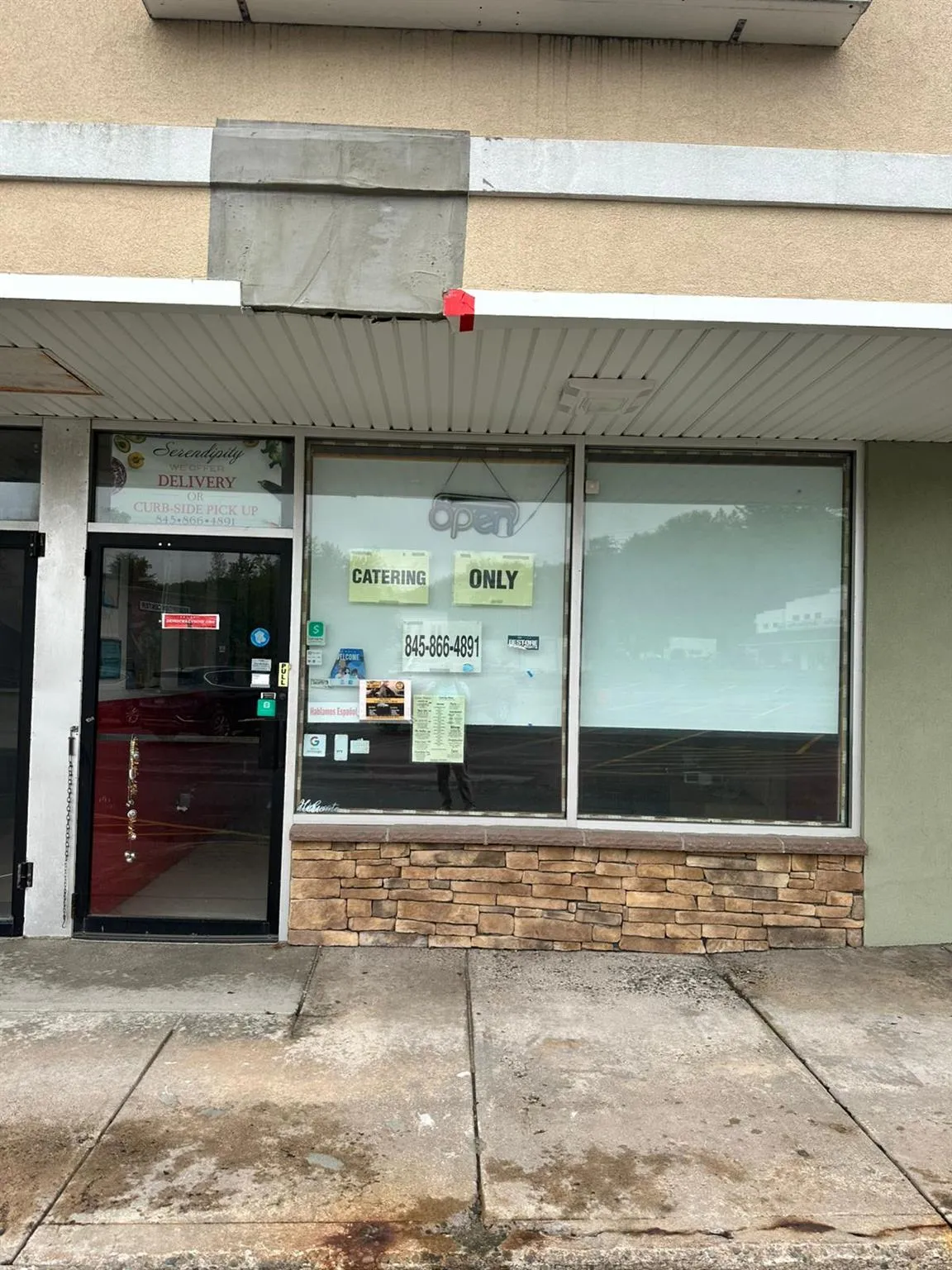 Doorway to property featuring stucco siding Doorway to property featuring stucco siding