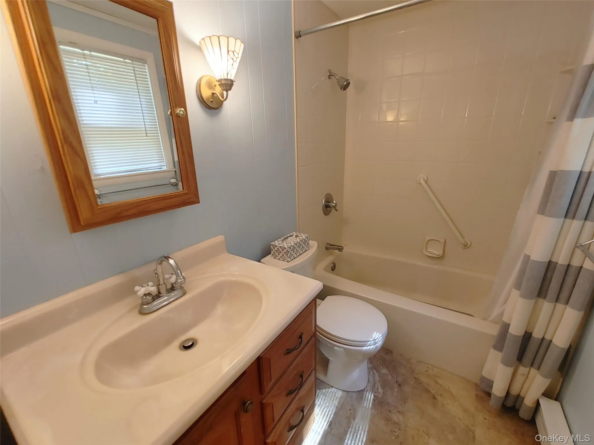 Full bath with vanity and shower / bath combination with curtain Full bath with vanity and shower / bath combination with curtain
