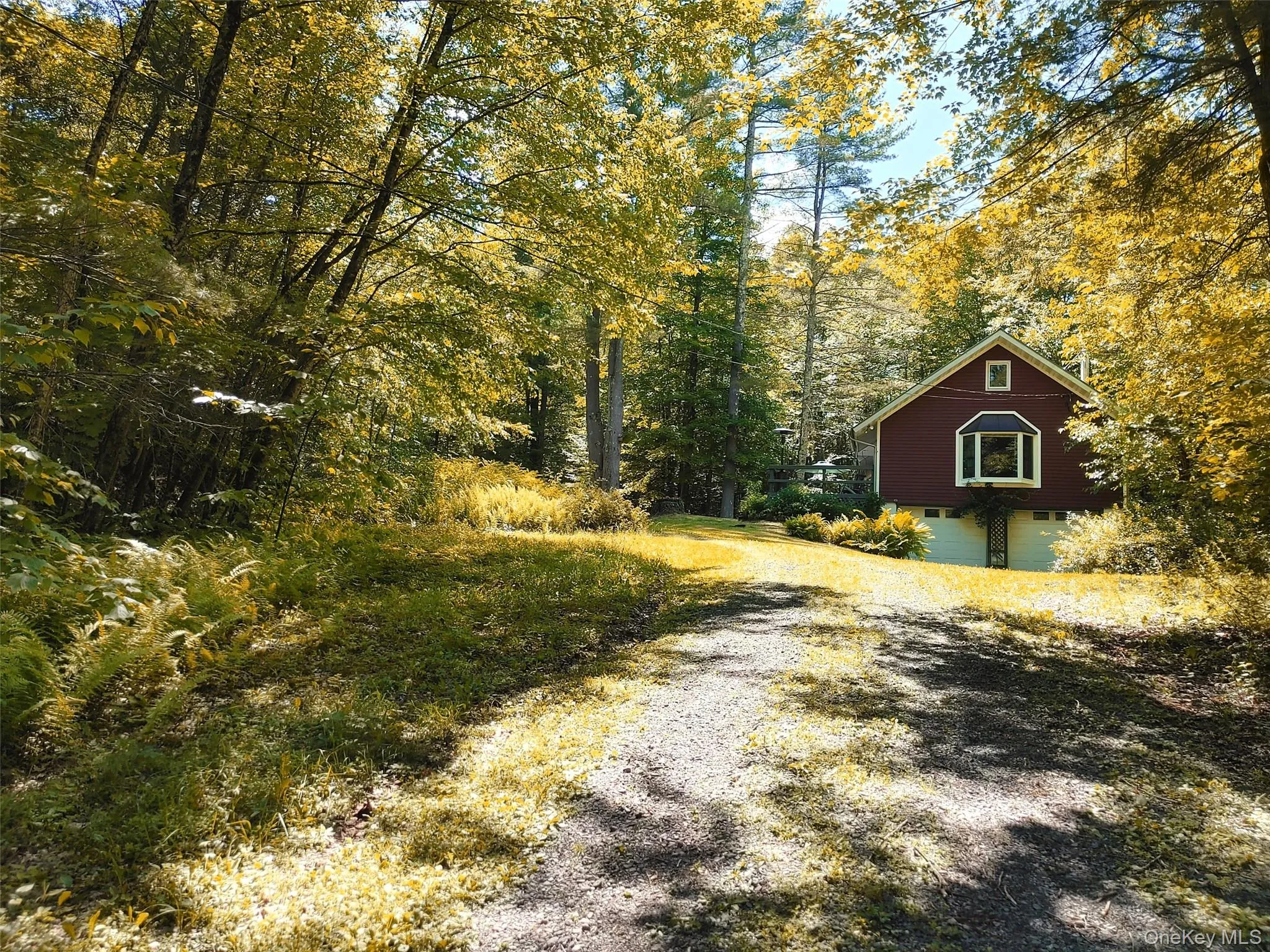 View of gravel driveway leading to the house. View of gravel driveway leading to the house.
