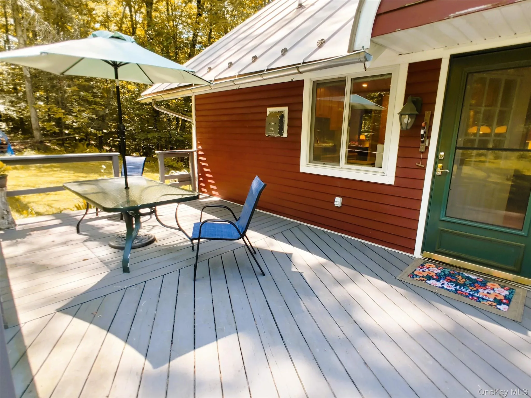 Wooden terrace featuring outdoor dining space Wooden terrace featuring outdoor dining space