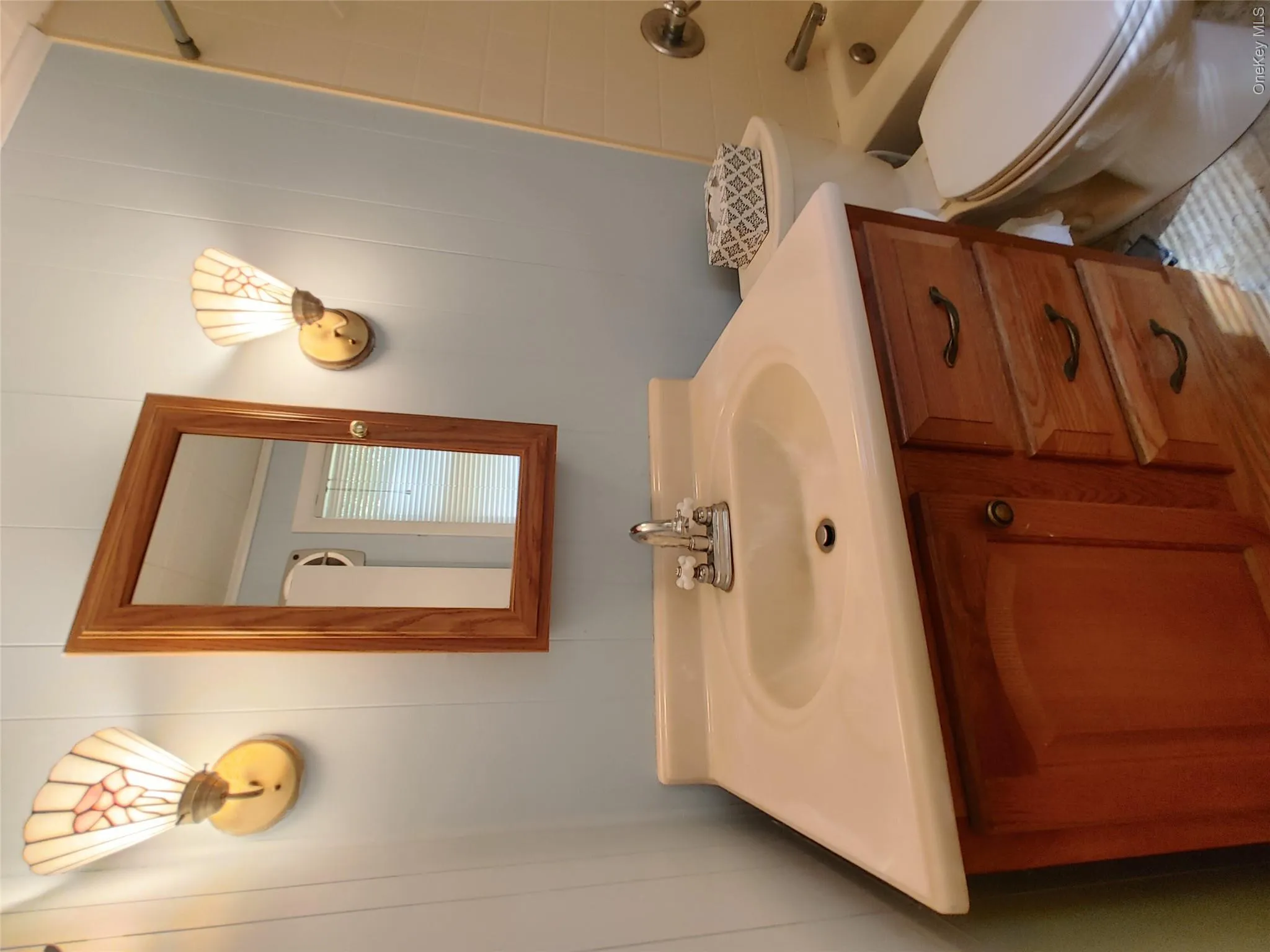 Full bathroom featuring vanity and bathing tub / shower combination Full bathroom featuring vanity and bathing tub / shower combination