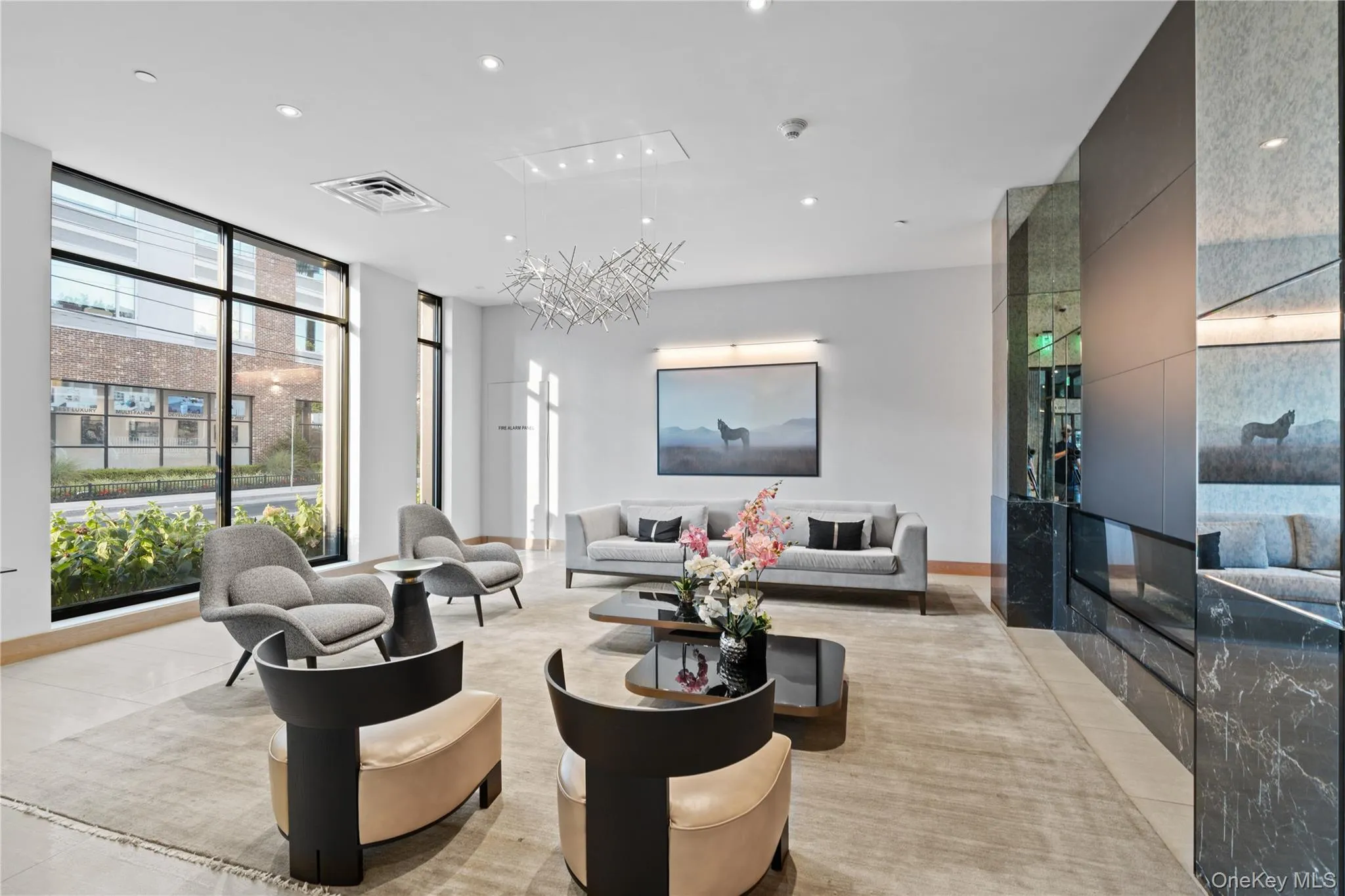 Common area with expansive windows and recessed lighting Common area with expansive windows and recessed lighting