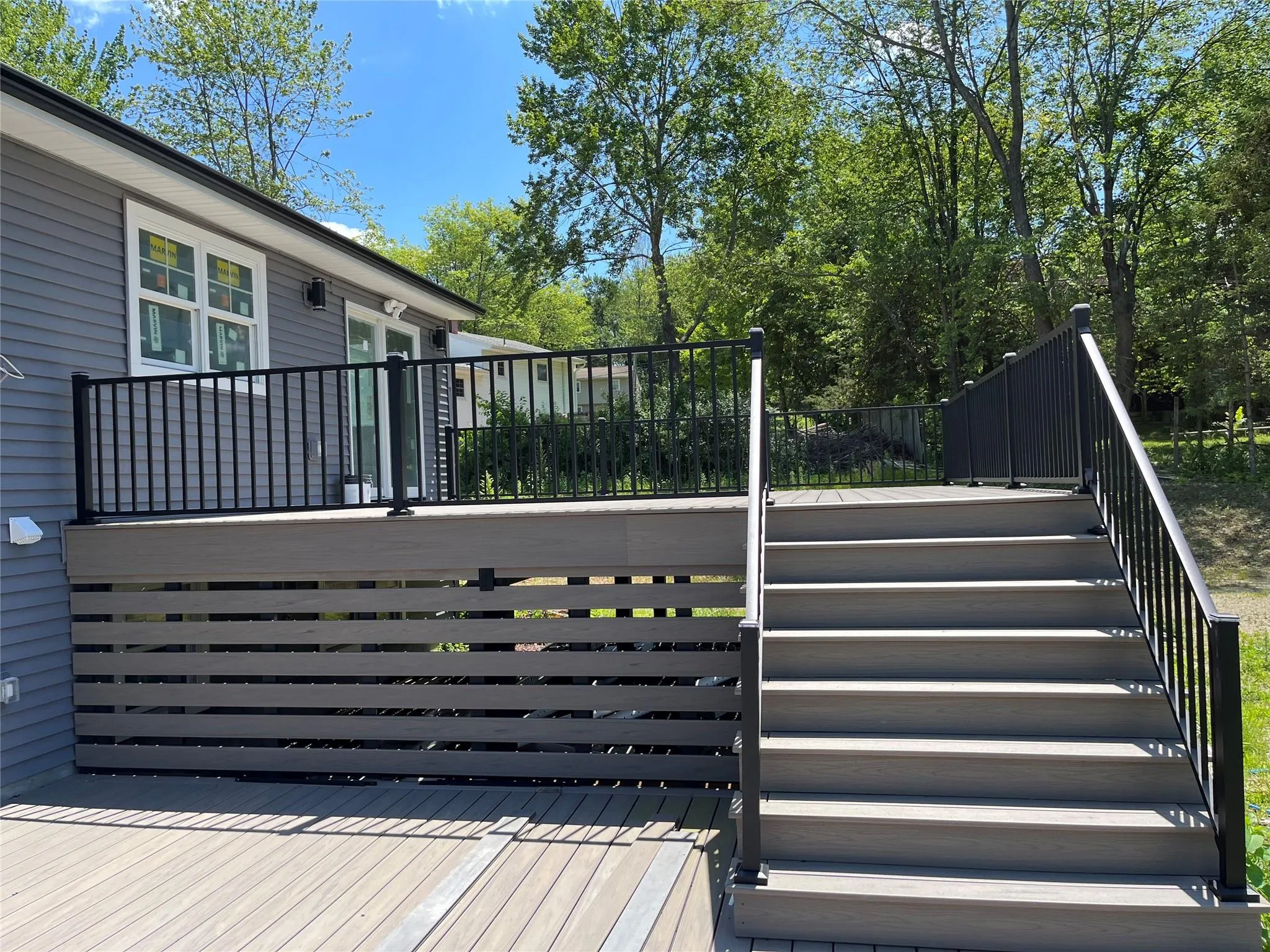 Wooden deck featuring stairs Wooden deck featuring stairs