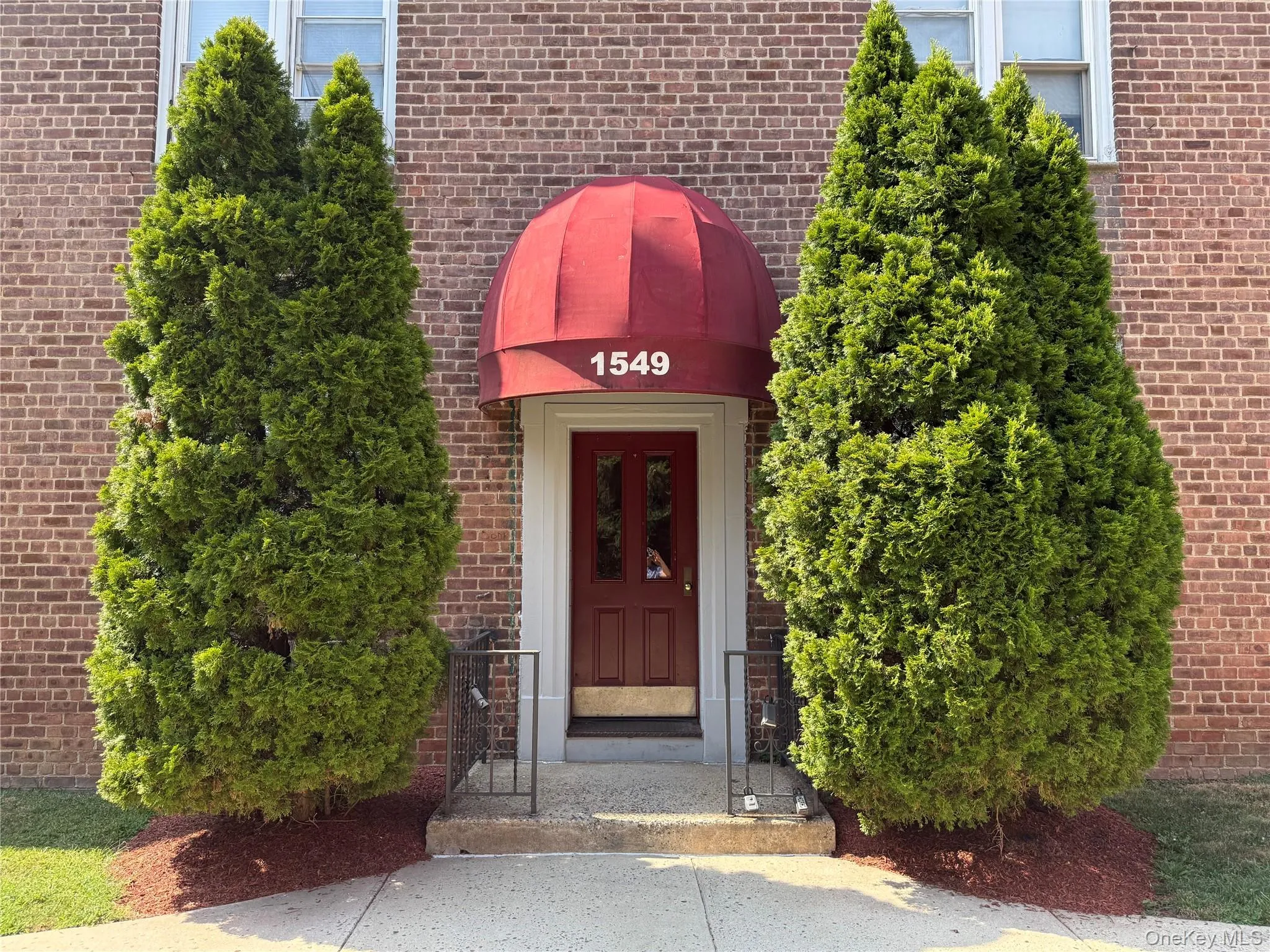 Entrance to property featuring brick siding Entrance to property featuring brick siding