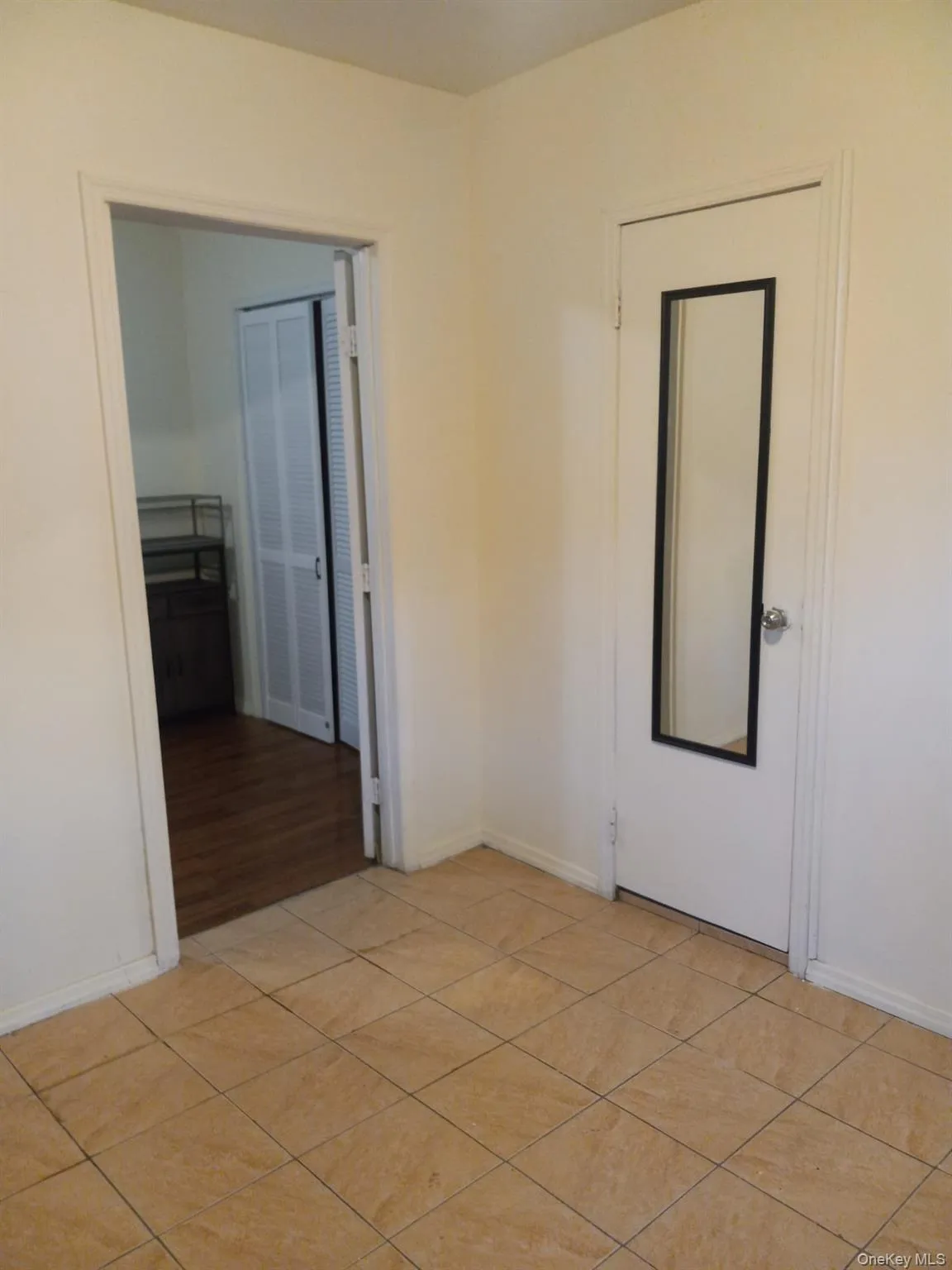 Spare room featuring baseboards and light wood-type flooring Spare room featuring baseboards and light wood-type flooring