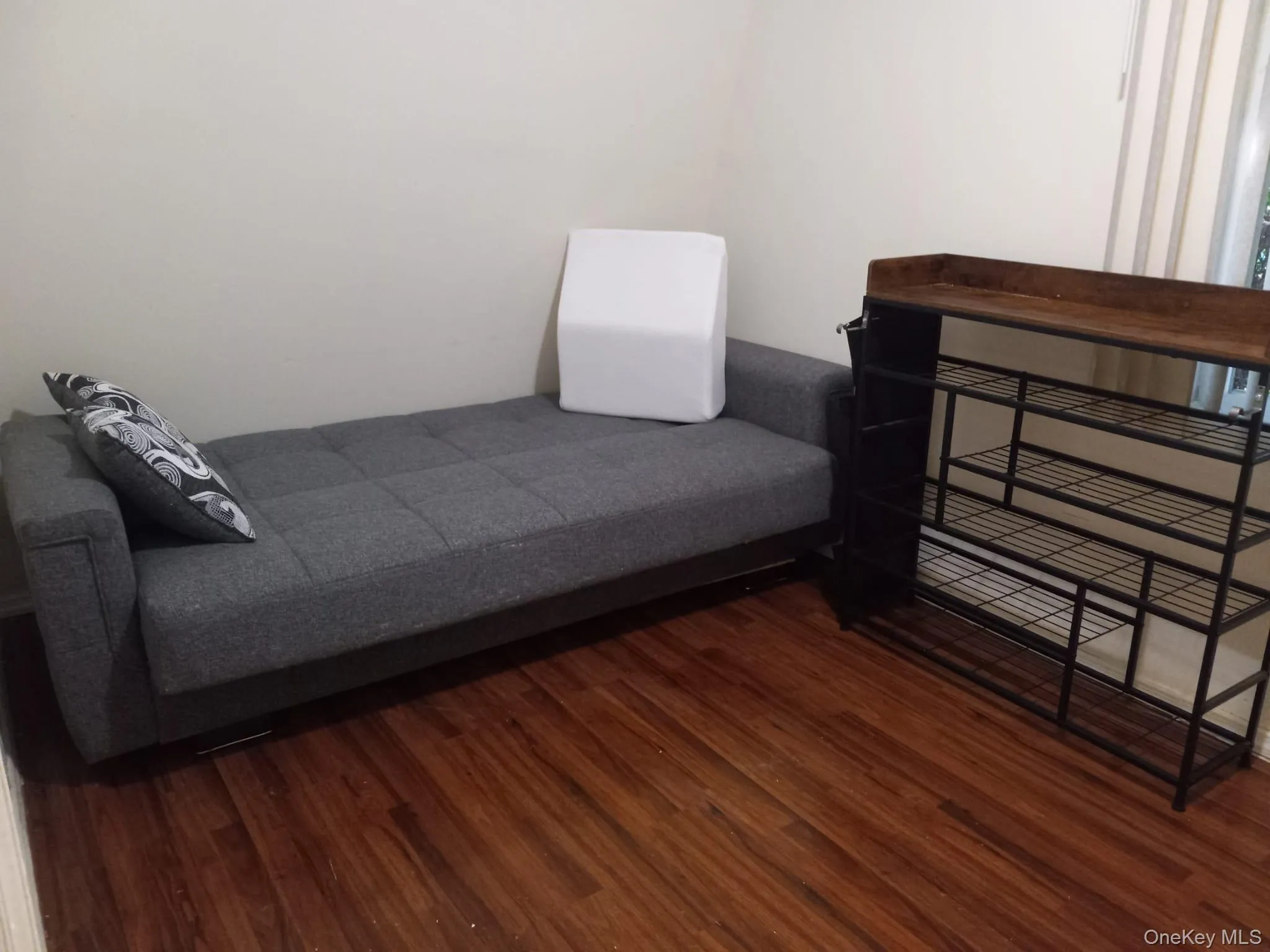 Bedroom featuring wood finished floors Bedroom featuring wood finished floors