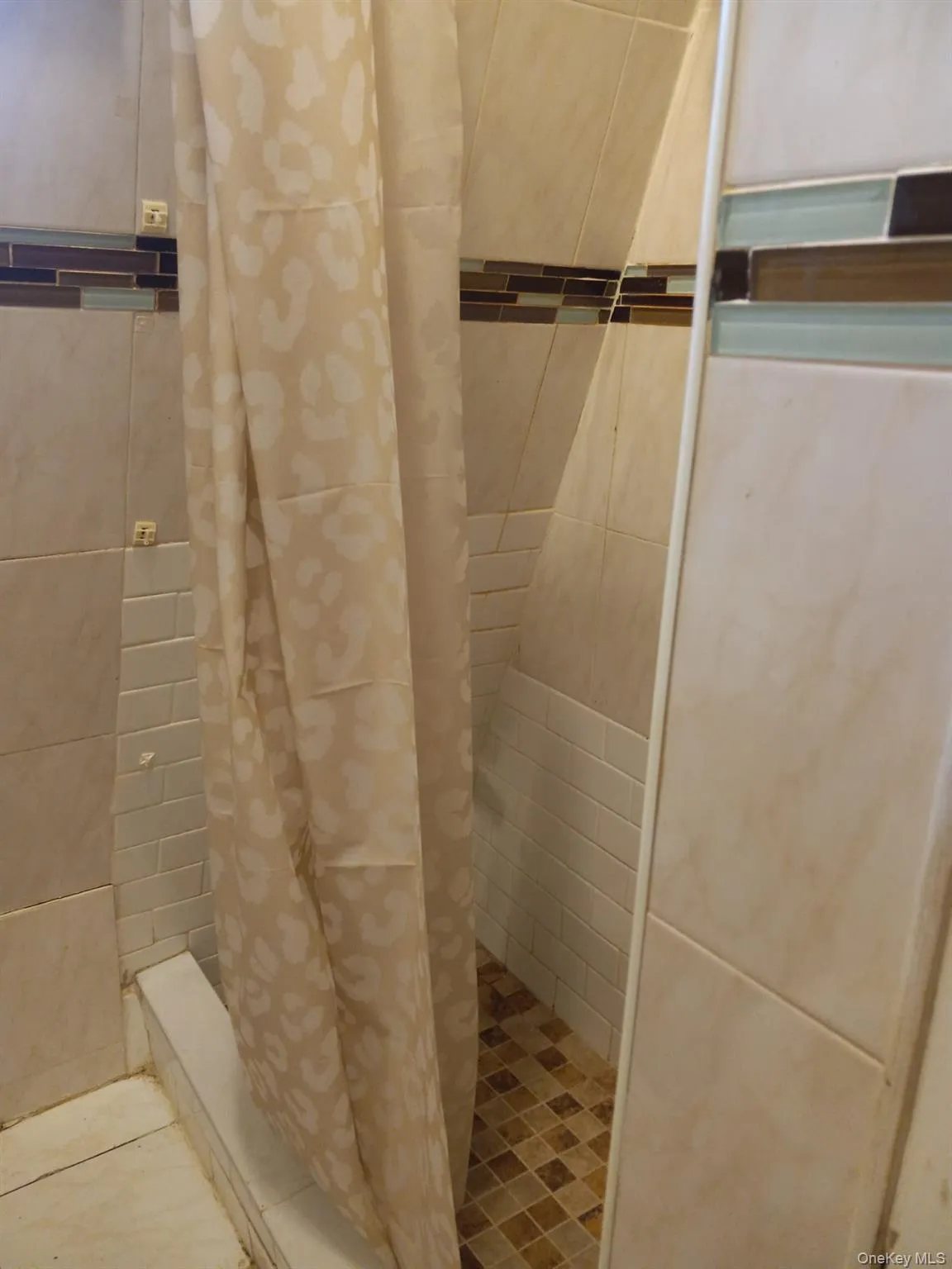 Full bath with a tile shower Full bath with a tile shower