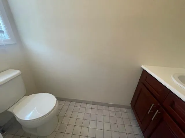 Bathroom featuring vanity and tile patterned floors Bathroom featuring vanity and tile patterned floors