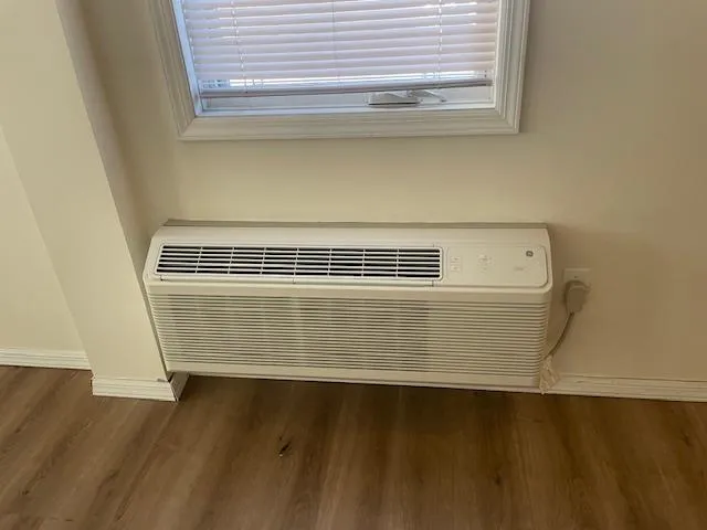 Detailed view of baseboards and wood finished floors Detailed view of baseboards and wood finished floors