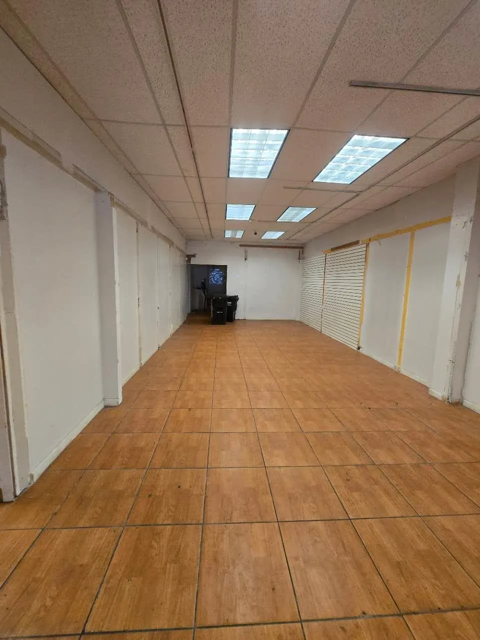 Basement featuring a drop ceiling Basement featuring a drop ceiling