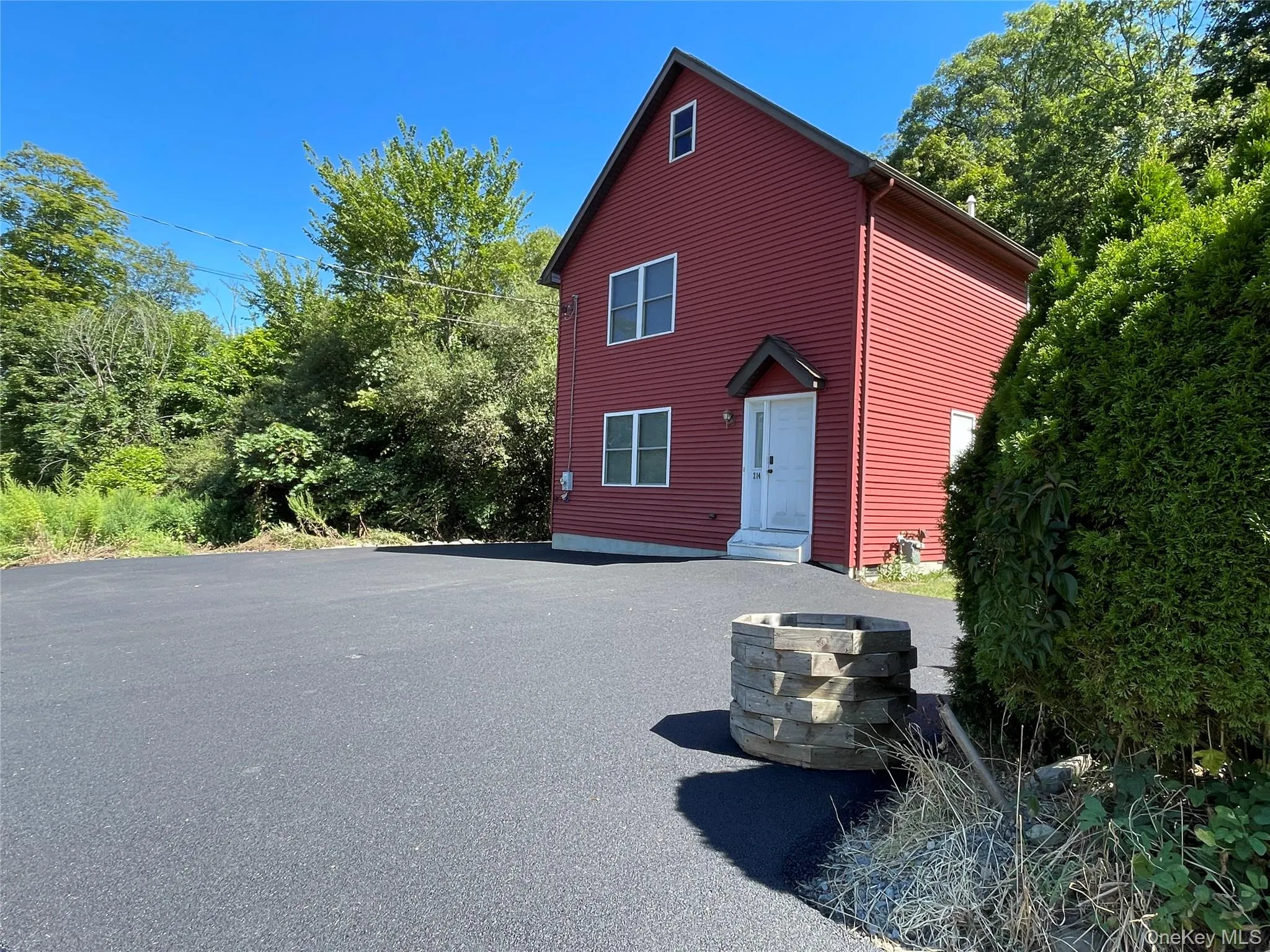 View of front of house with asphalt driveway View of front of house with asphalt driveway