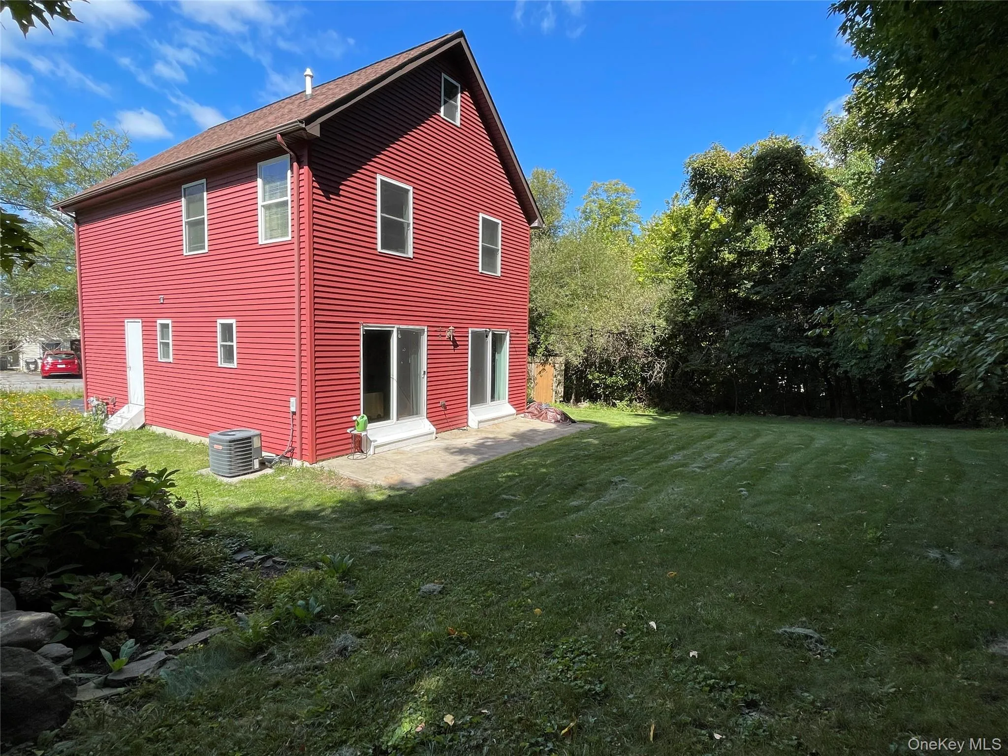 Rear view of house with a lawn Rear view of house with a lawn