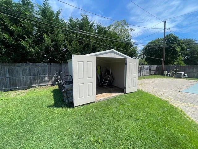 View of shed with a fenced backyard View of shed with a fenced backyard