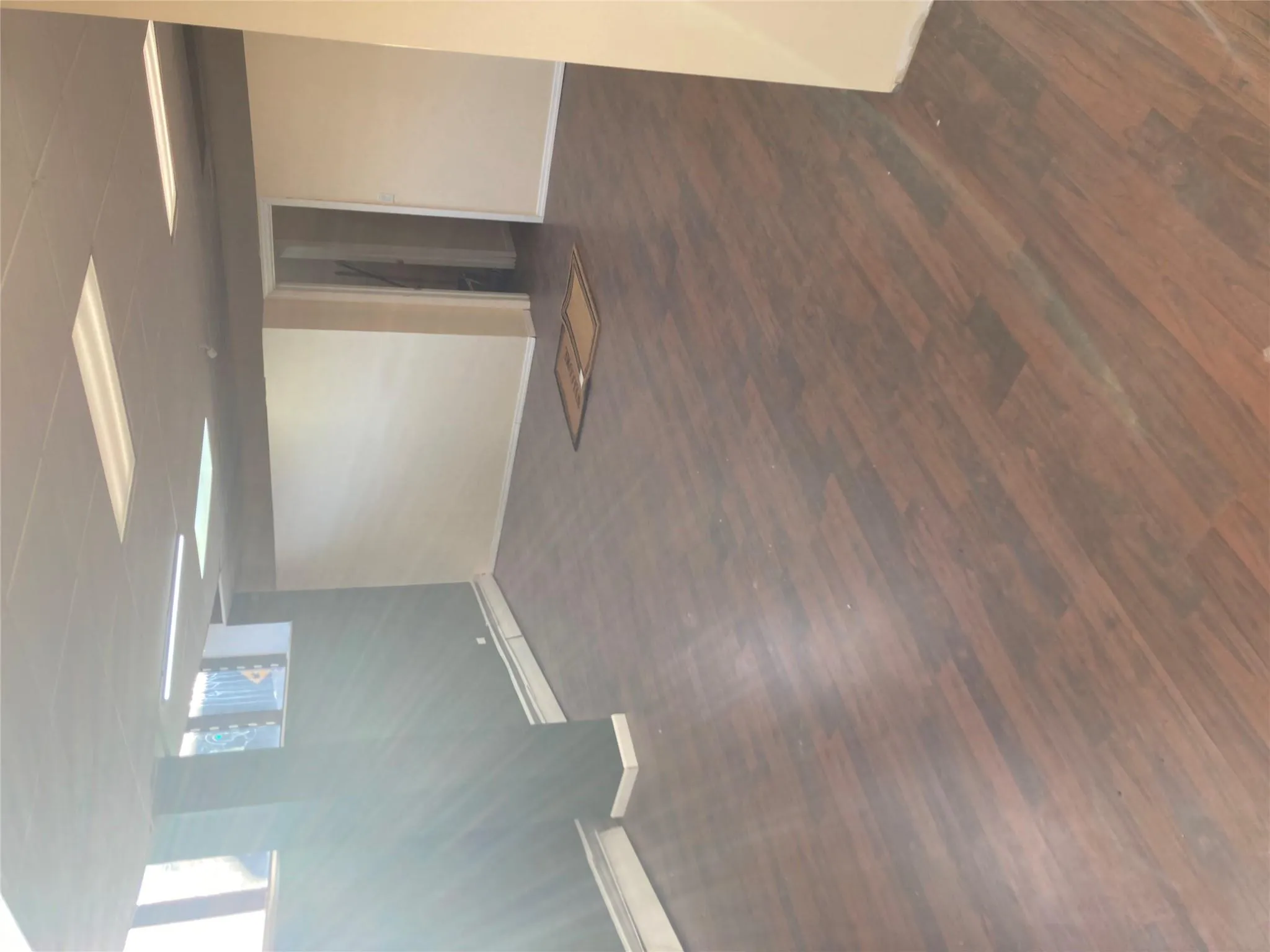 Basement featuring baseboards and wood finished floors Basement featuring baseboards and wood finished floors