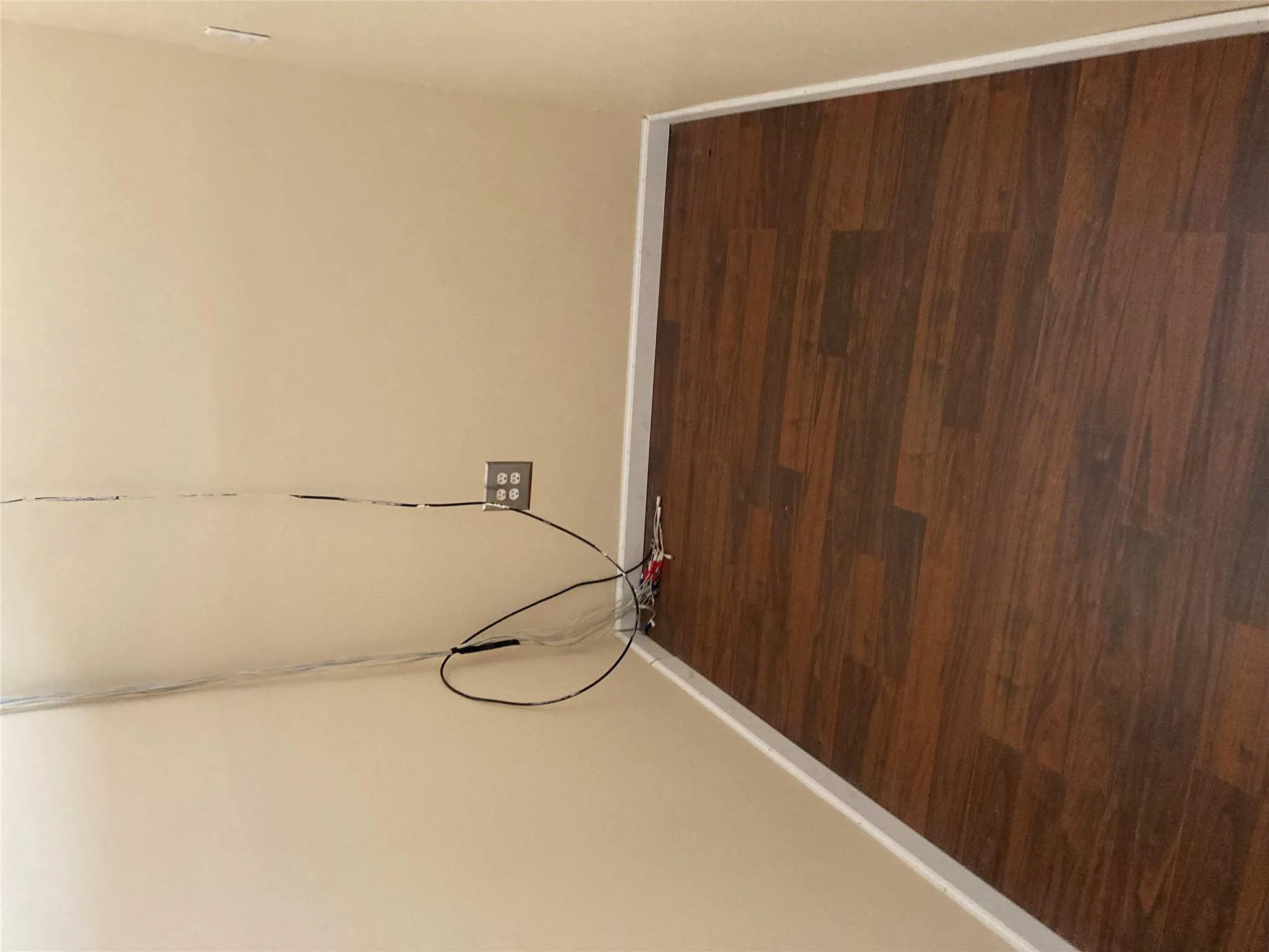 Laundry area with baseboards and dark wood-style flooring Laundry area with baseboards and dark wood-style flooring