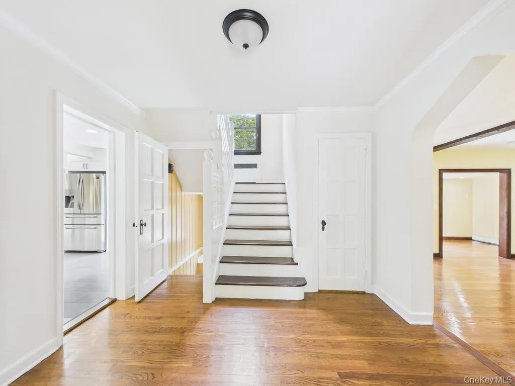 Stairs with wood finished floors and ornamental molding Stairs with wood finished floors and ornamental molding