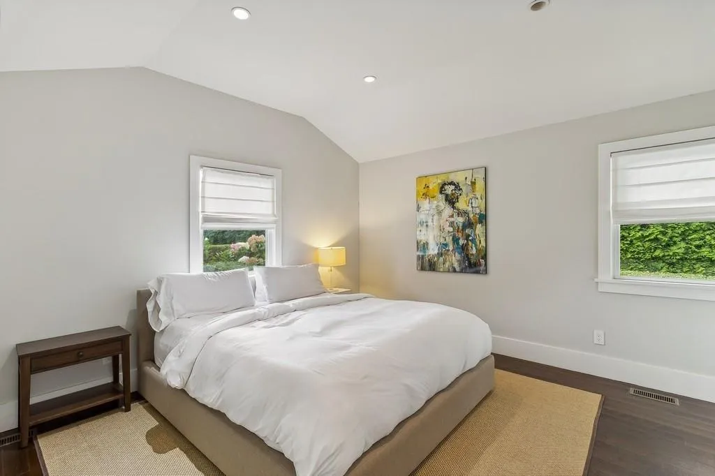 Bedroom featuring lofted ceiling, wood finished floors, and recessed lighting Bedroom featuring lofted ceiling, wood finished floors, and recessed lighting