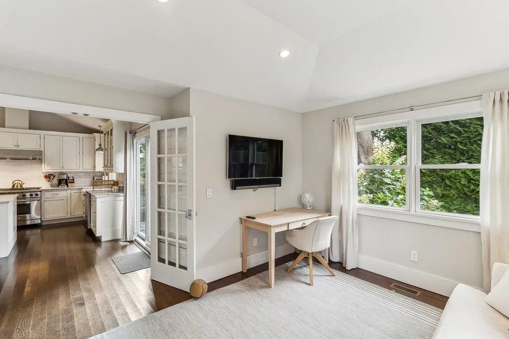 Home office featuring lofted ceiling, dark wood finished floors, and recessed lighting Home office featuring lofted ceiling, dark wood finished floors, and recessed lighting