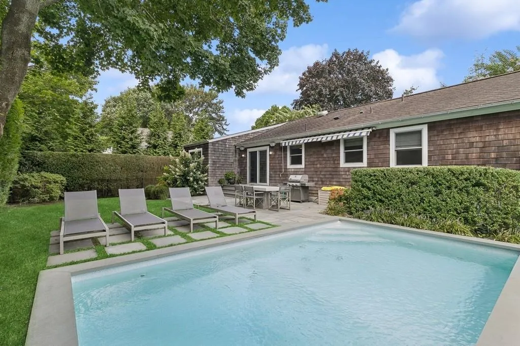 View of swimming pool with area for grilling and a patio area View of swimming pool with area for grilling and a patio area