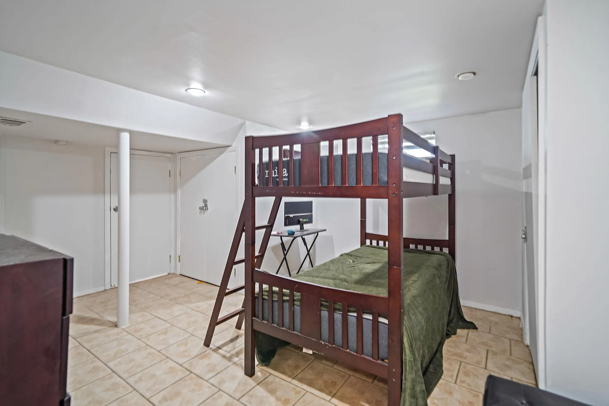 Bedroom with light tile patterned floors Bedroom with light tile patterned floors