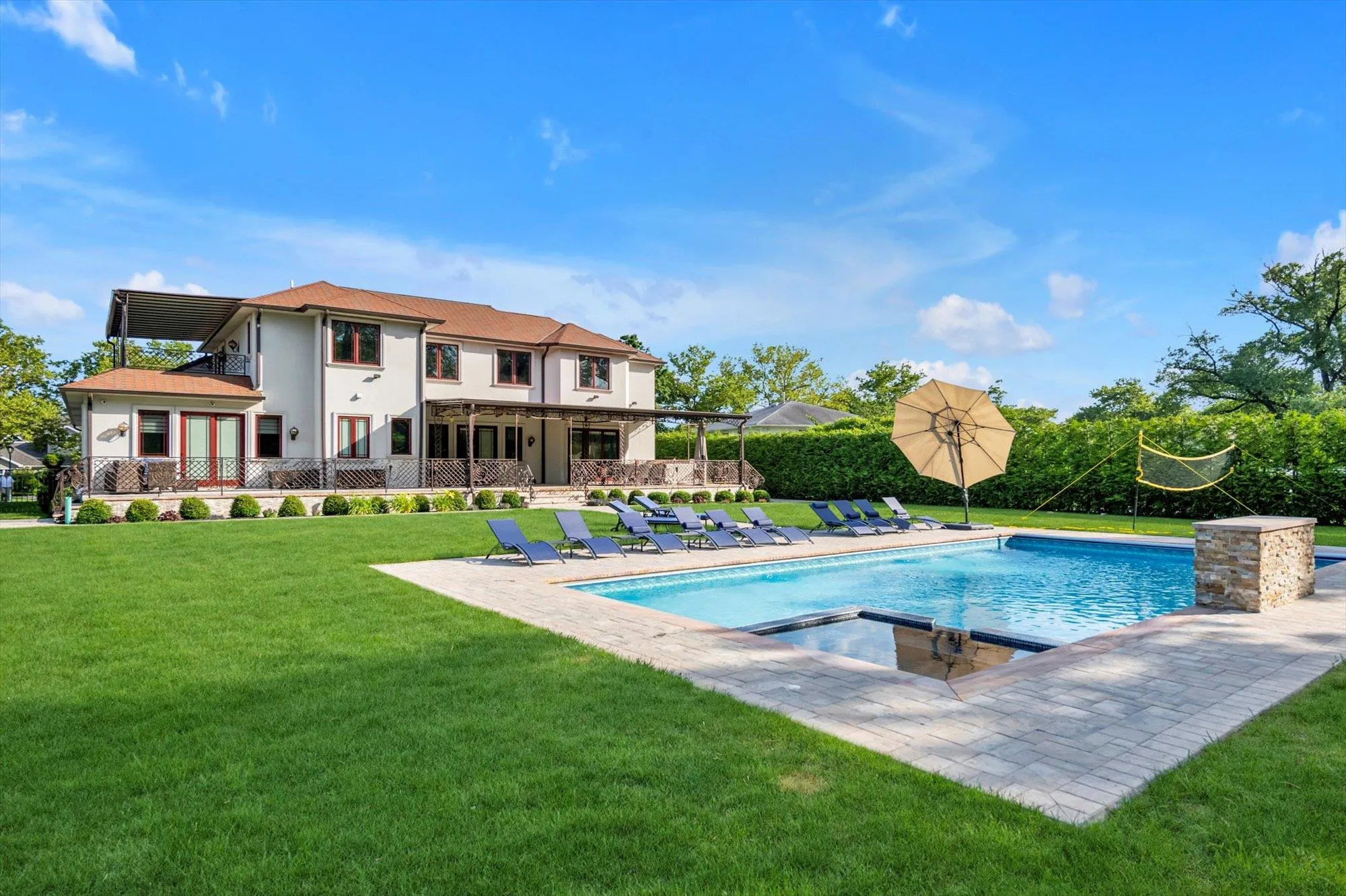 View of swimming pool with a lawn, a patio area, and a pool with connected hot tub View of swimming pool with a lawn, a patio area, and a pool with connected hot tub