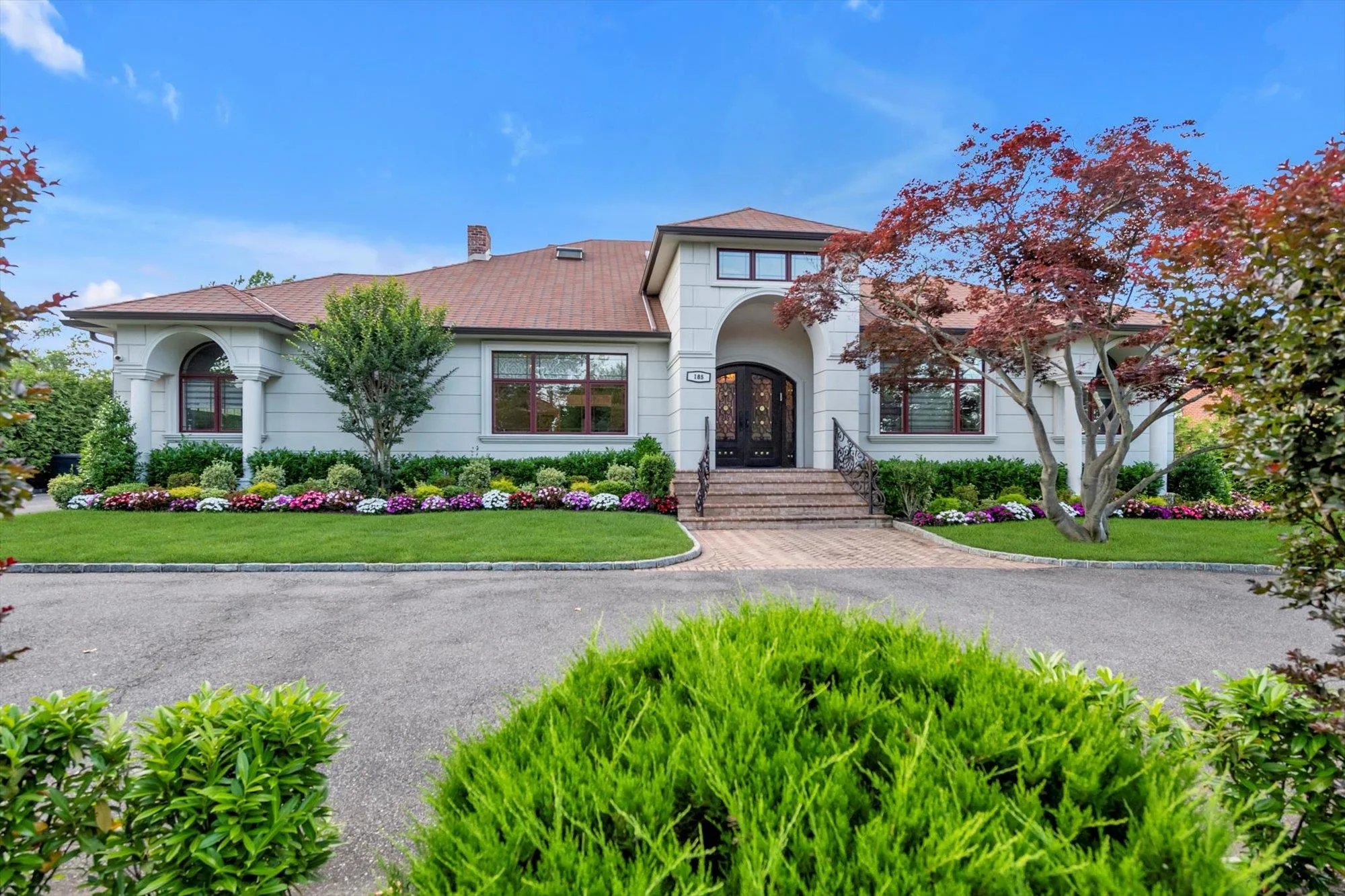 Mediterranean / spanish-style home featuring french doors, a chimney, and a front lawn Mediterranean / spanish-style home featuring french doors, a chimney, and a front lawn